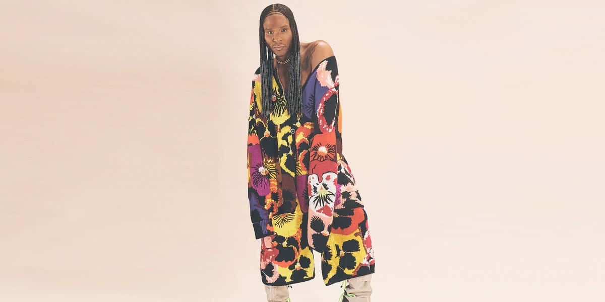 Law Roach, floral off-shoulder coat, soft beige studio backdrop, SD Desktop Wallpaper