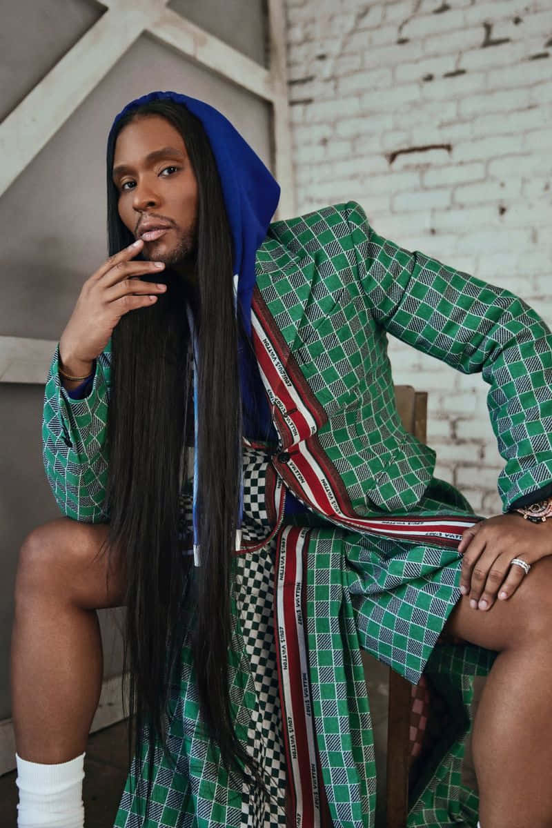 Law Roach, bold green plaid outfit, white brick wall, SD Phone Wallpaper