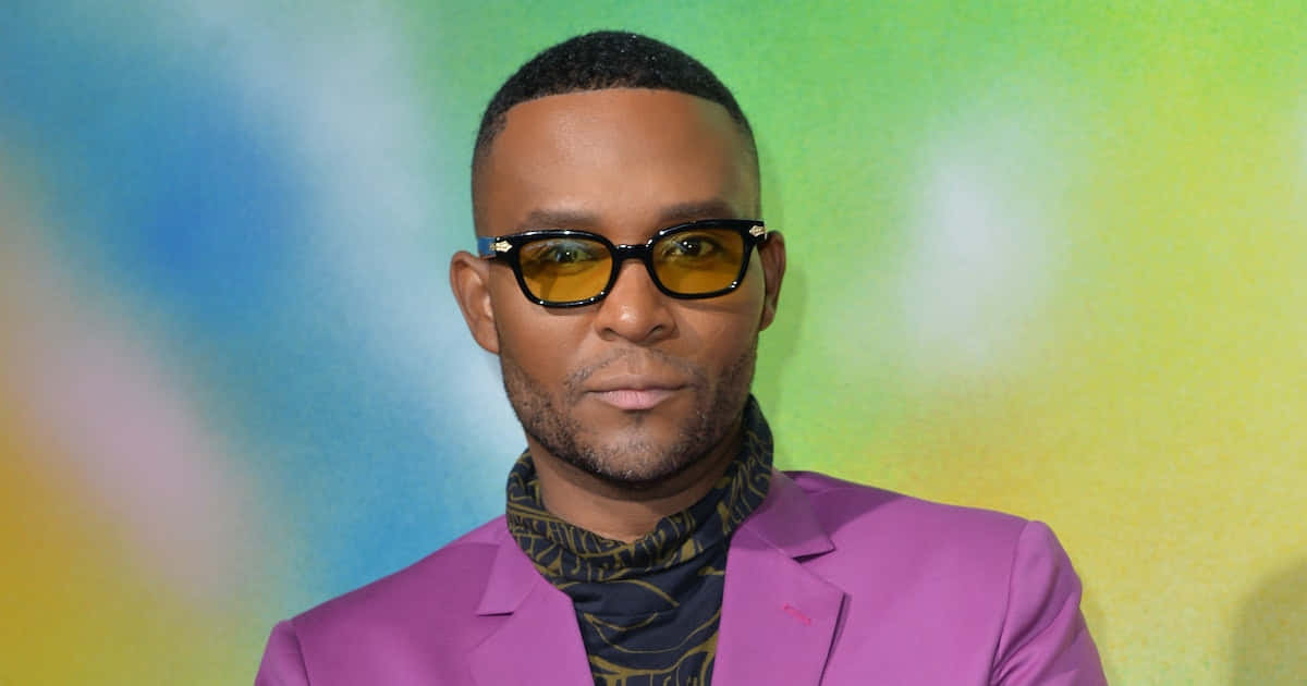 Law Roach, vibrant purple suit, yellow-tinted sunglasses, SD Desktop Wallpaper