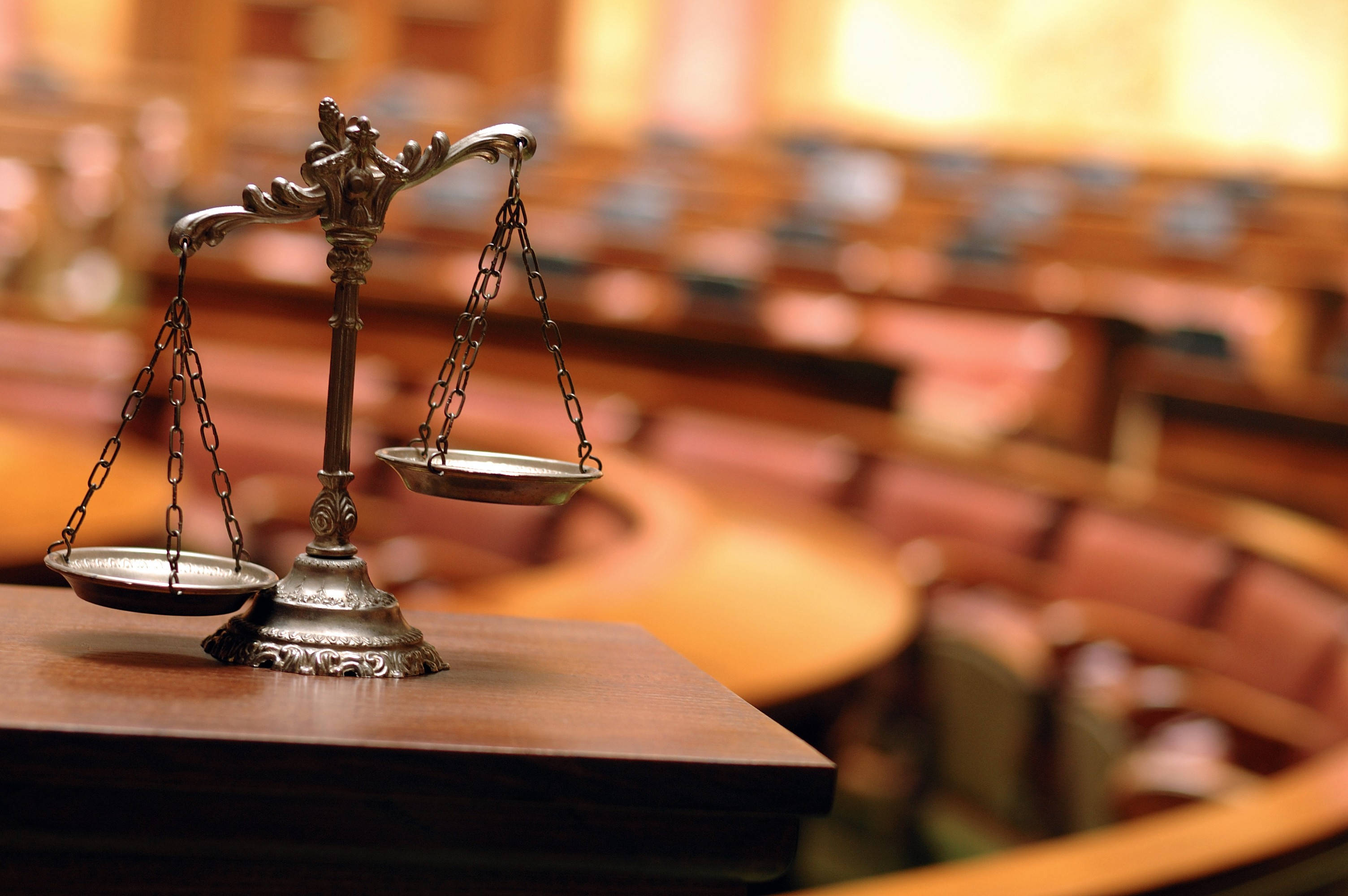 metal justice scale, wooden table, warmly lit courtroom, 2K Desktop Wallpaper