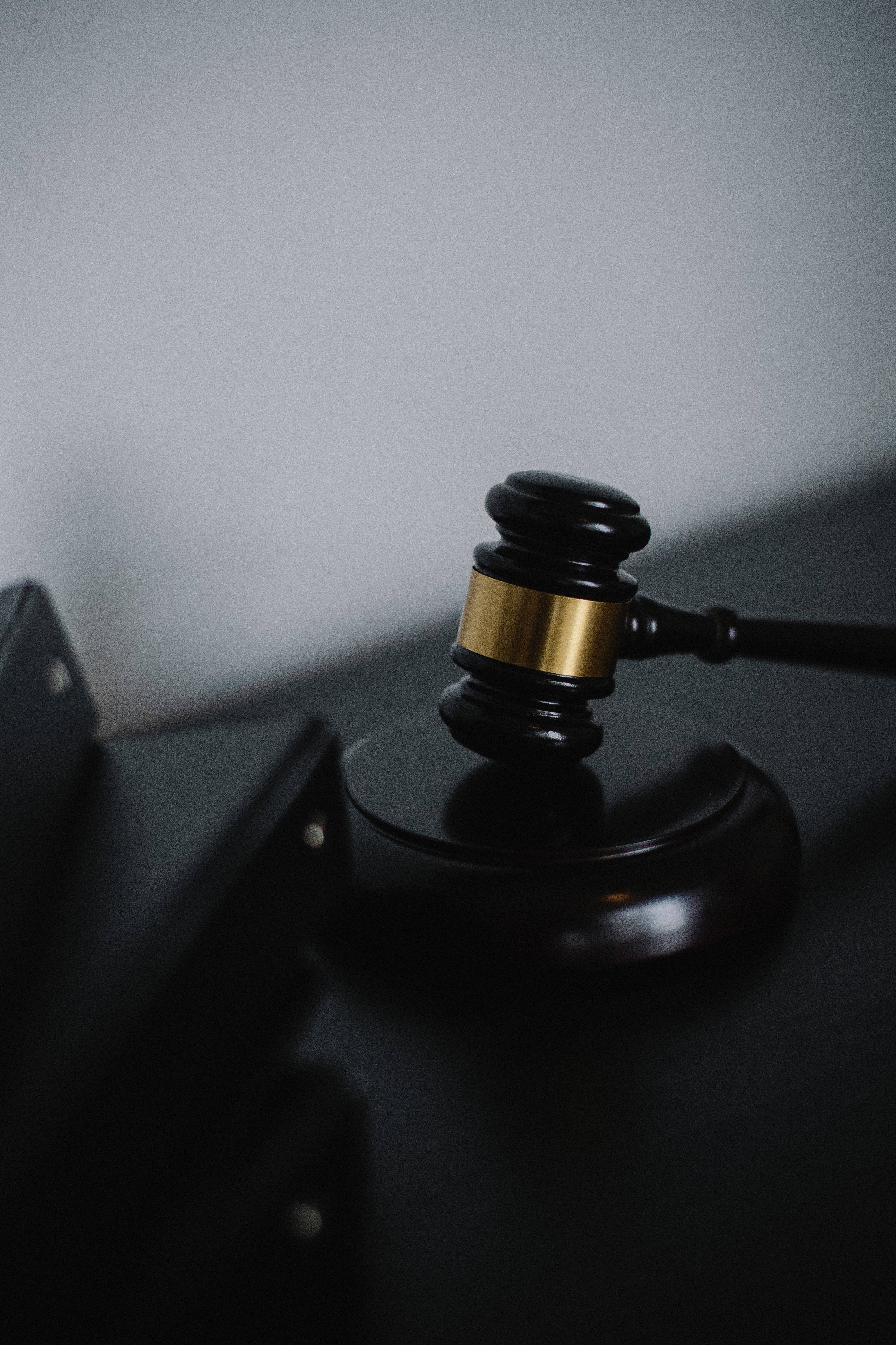 black wooden gavel, gold band, muted gray background, 5K Phone Wallpaper