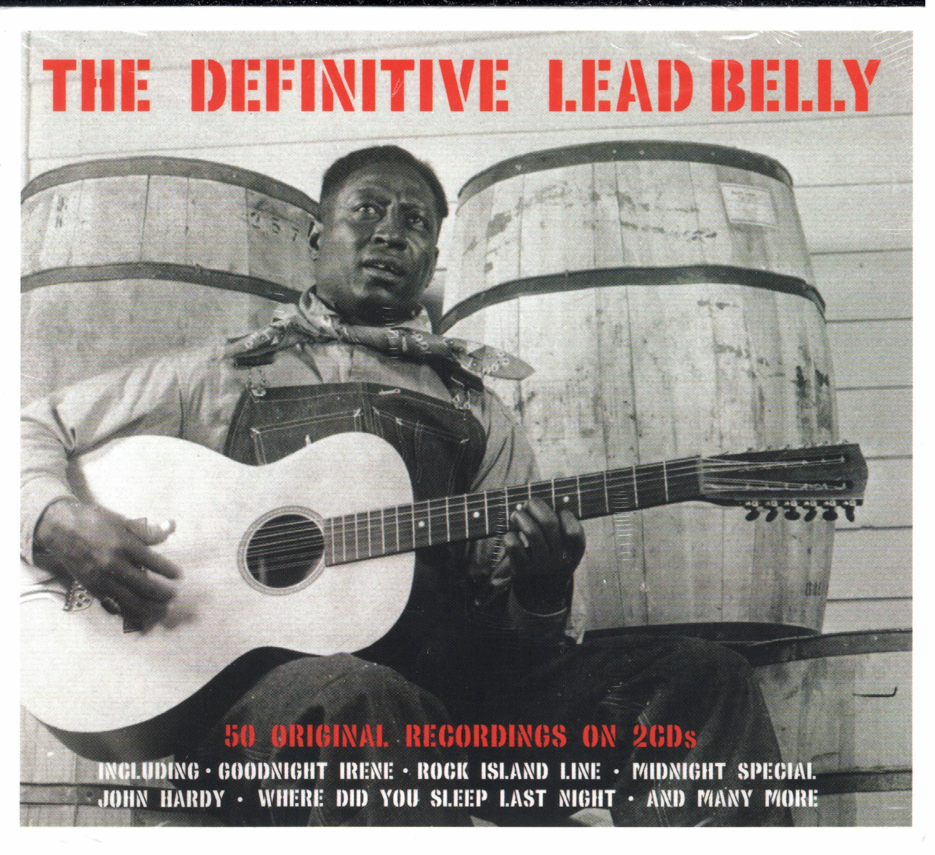 Leadbelly, acoustic guitar, wooden barrels, 2K Desktop Wallpaper