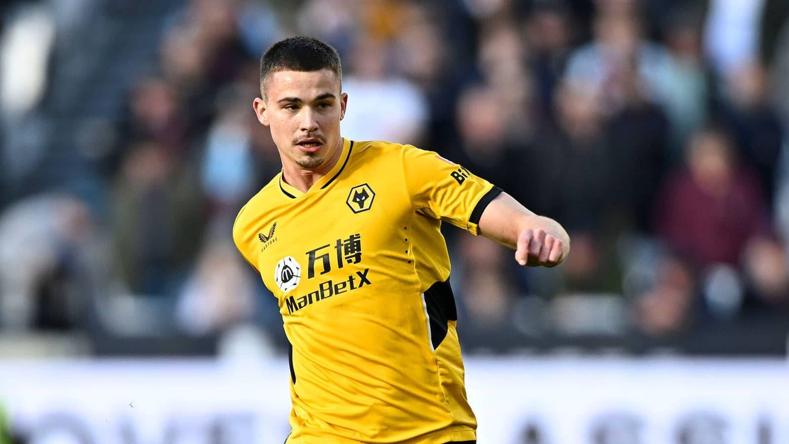 Leander Dendoncker, vibrant yellow jersey, stadium field, HD Desktop Wallpaper