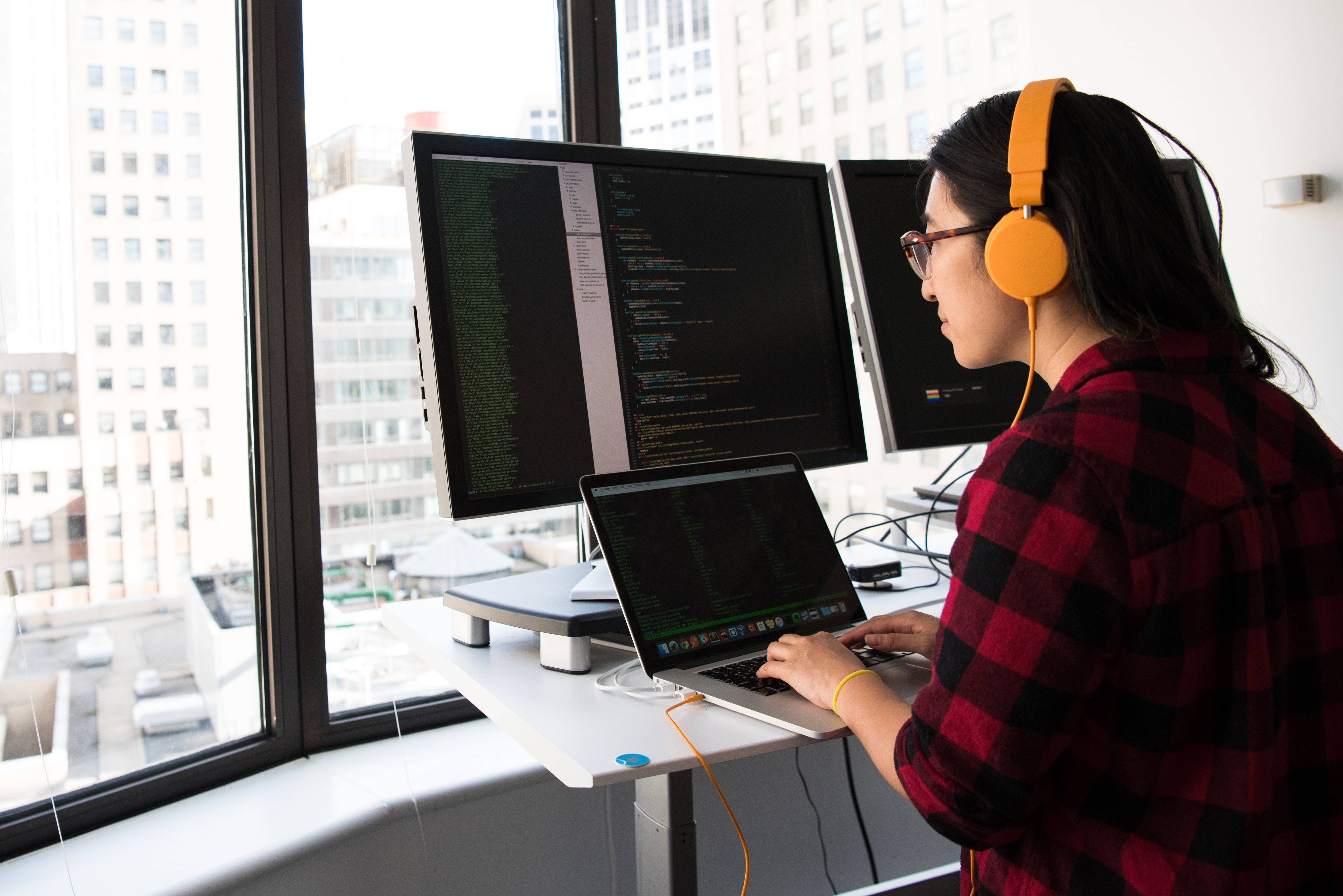 red plaid shirt, orange headphones, multiple monitors, 4K Desktop Wallpaper