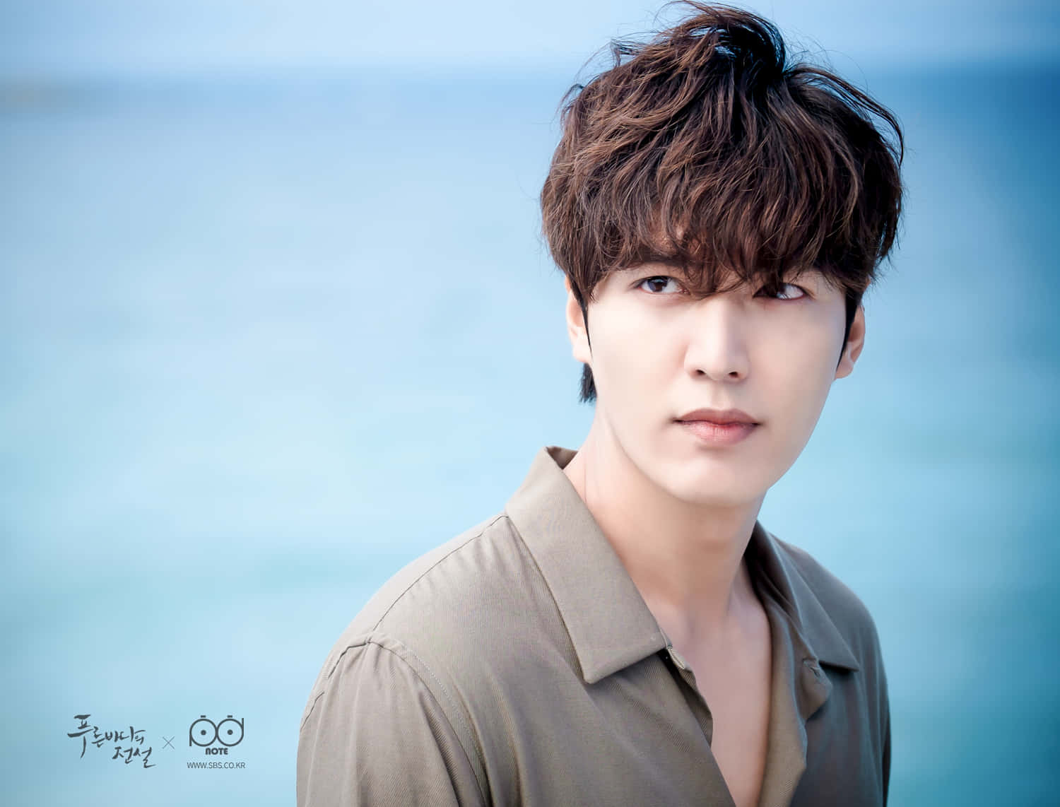 Lee Min Ho, tousled brown hair, soft blue ocean backdrop, HD Desktop Wallpaper
