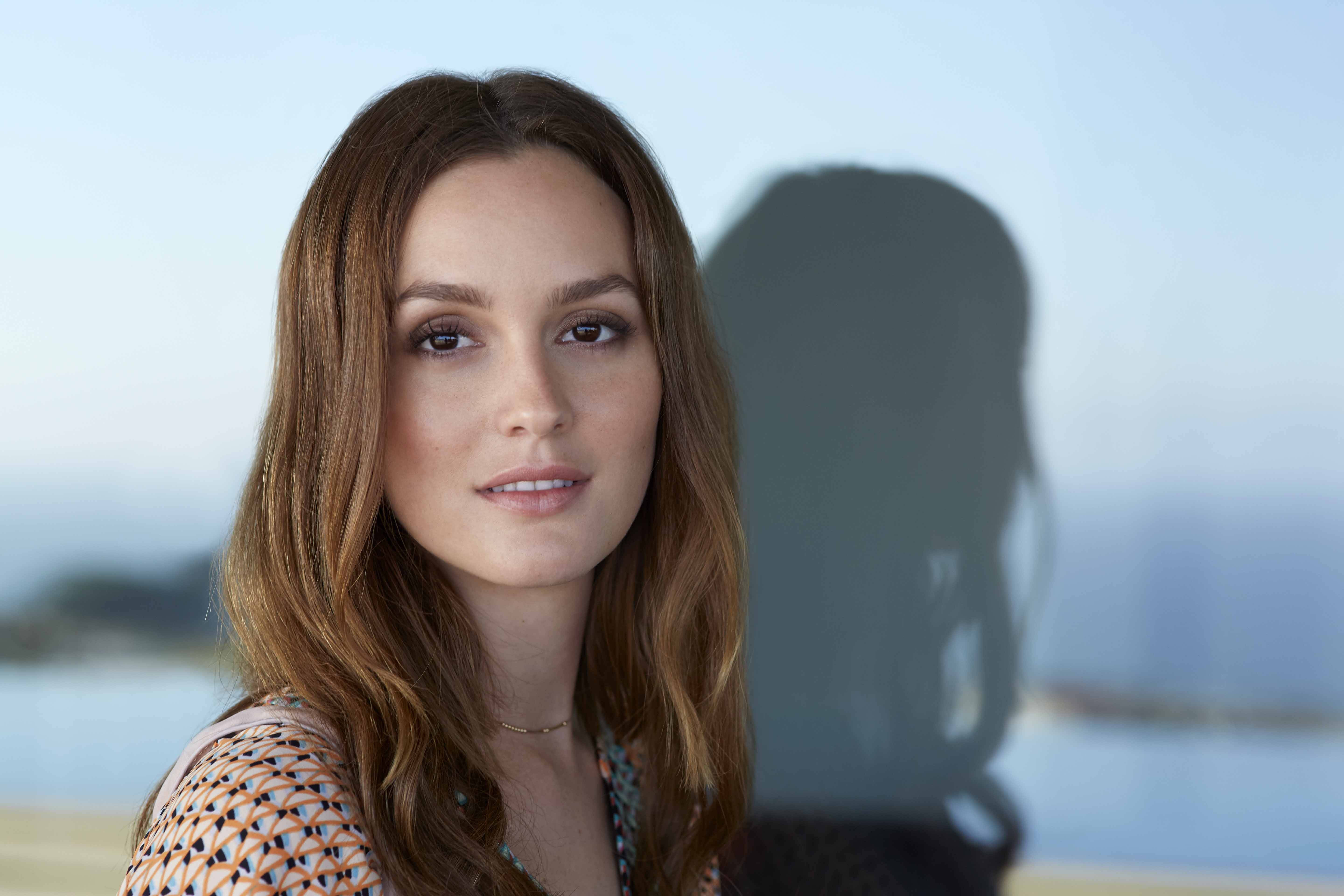 Leighton Meester, long brown hair, blurred coastal backdrop, 5K Desktop Wallpaper