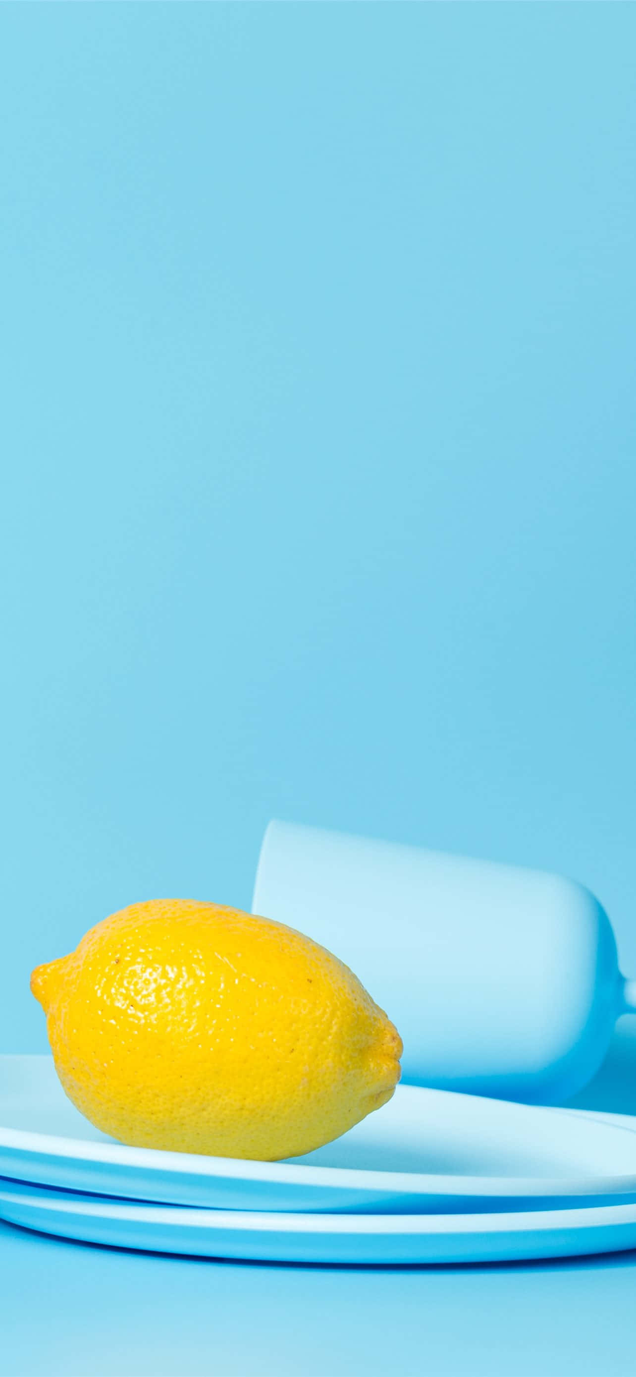 Lemon iPhone, bright yellow lemon, light blue plates, 2K Phone Wallpaper