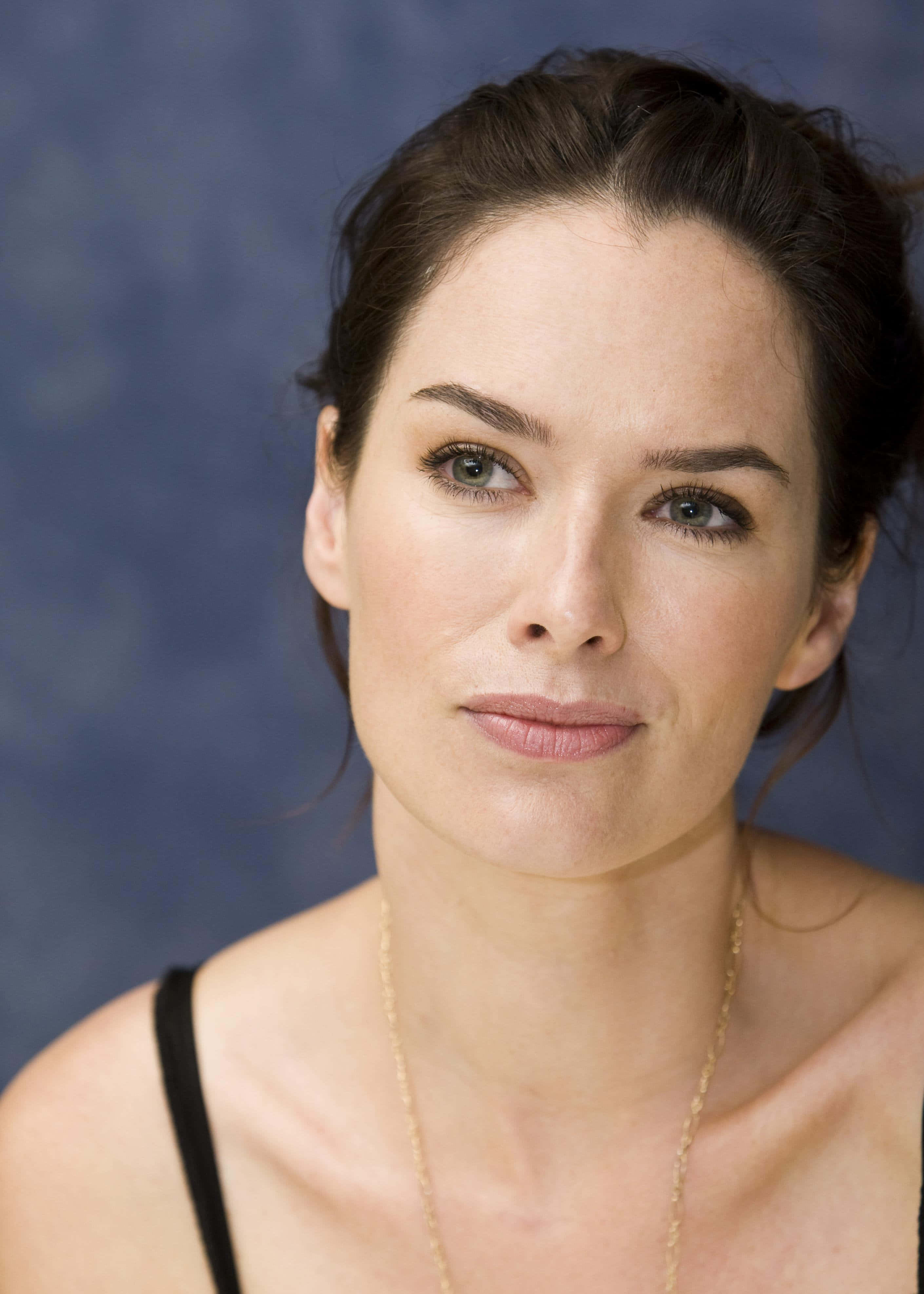 Lena Headey, dark hair, textured blue background, 4K Phone Wallpaper