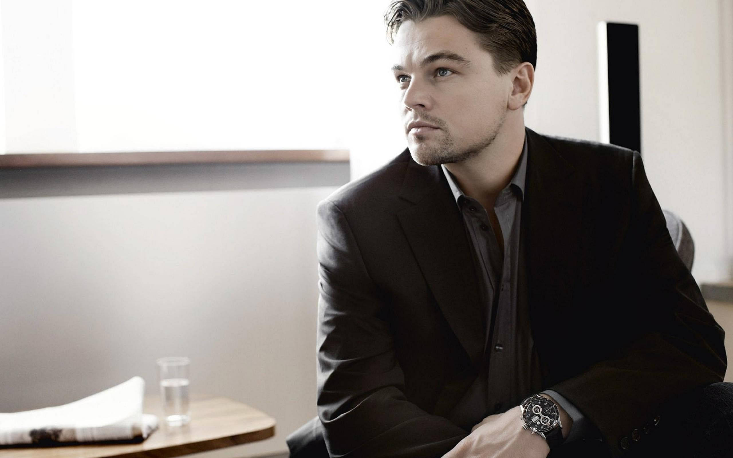 Leonardo DiCaprio, sleek black suit, window, 2K Desktop Wallpaper