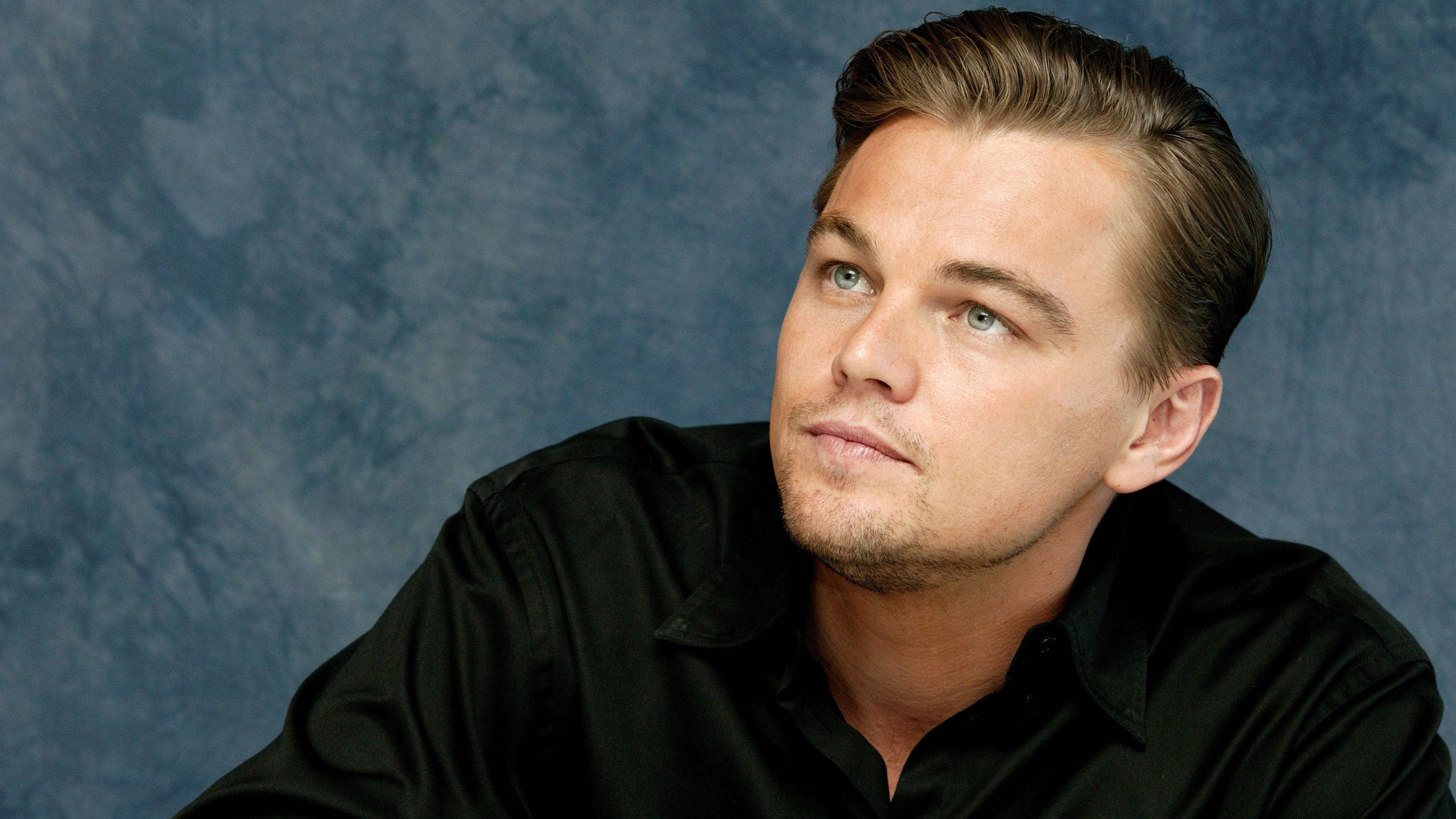 Leonardo DiCaprio, studio portrait, textured blue backdrop, 4K Desktop Wallpaper