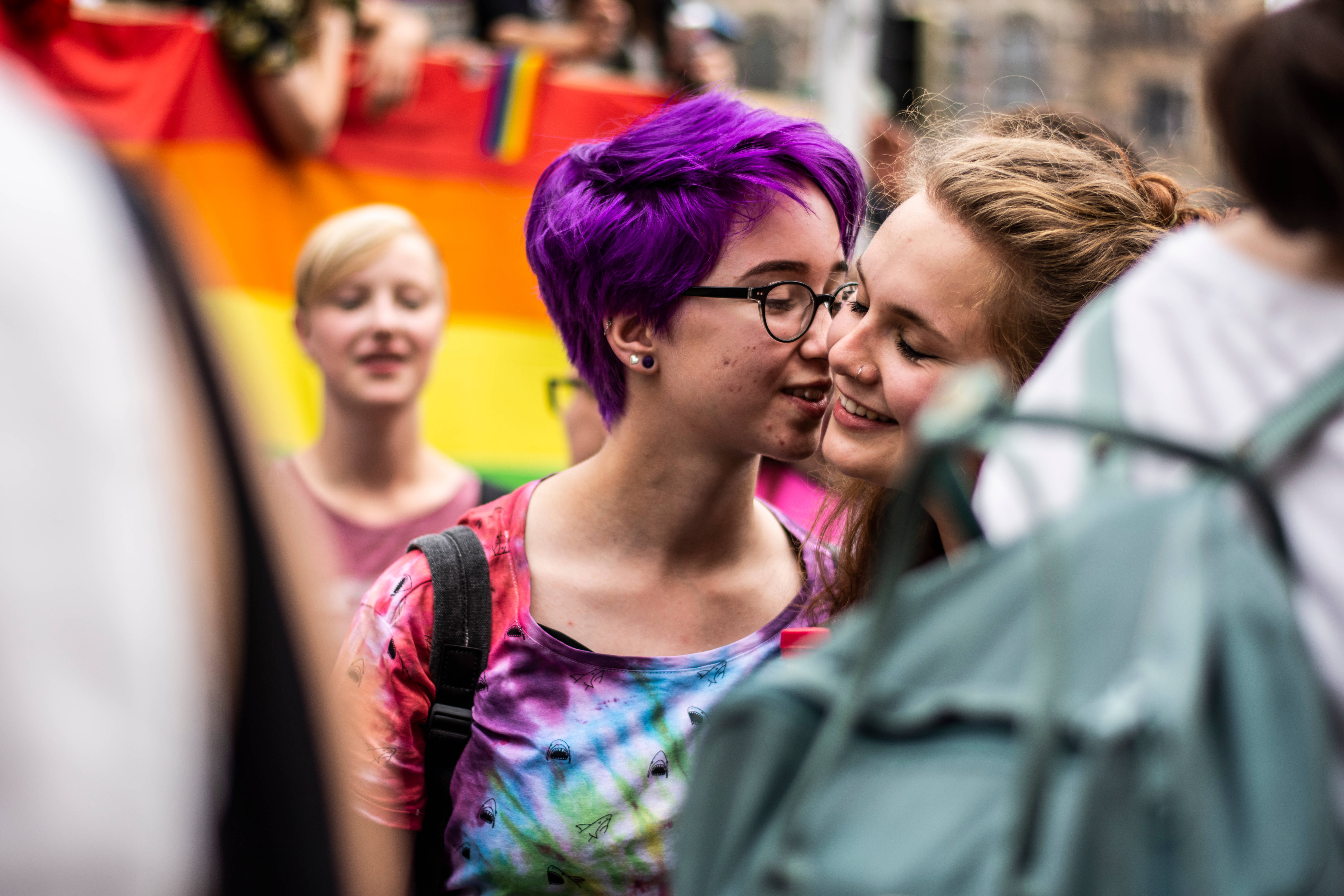 Pride parade, rainbow flags, vibrant purple hair, 5K Desktop Wallpaper