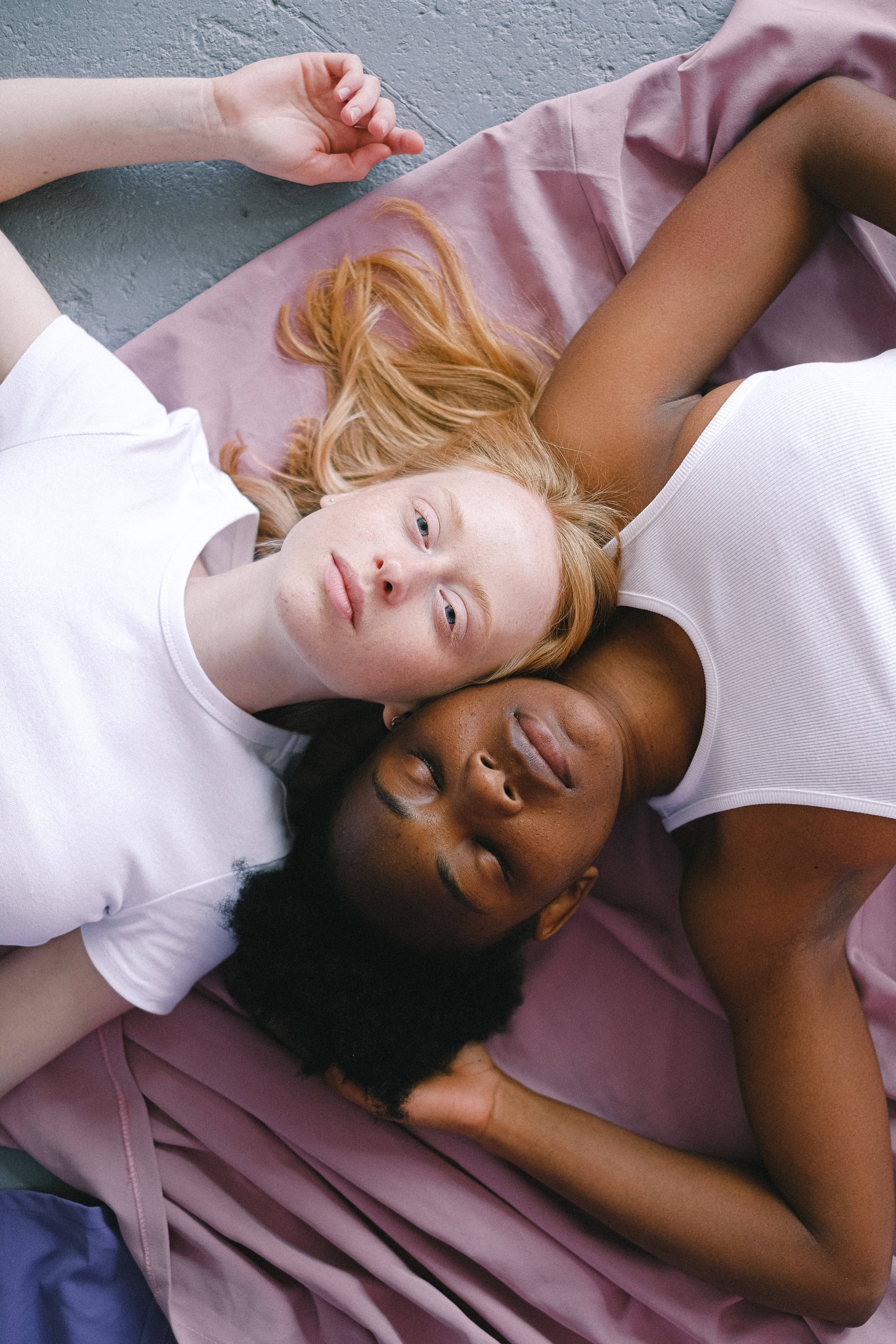 lesbian girl, pink blanket, gray concrete floor, 5K Phone Wallpaper