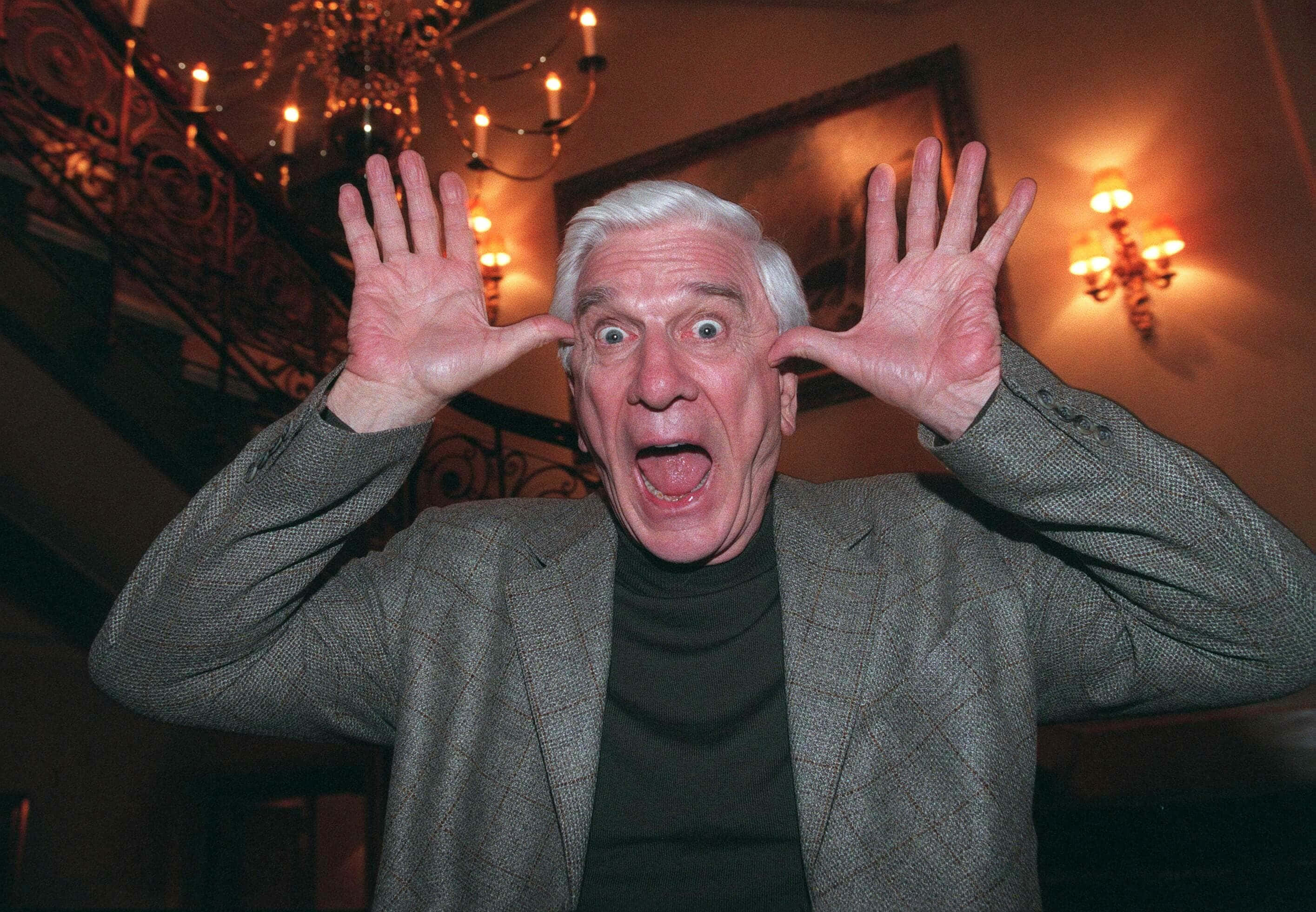 Leslie Nielsen, white hair, comical surprised face, 2K Desktop Wallpaper