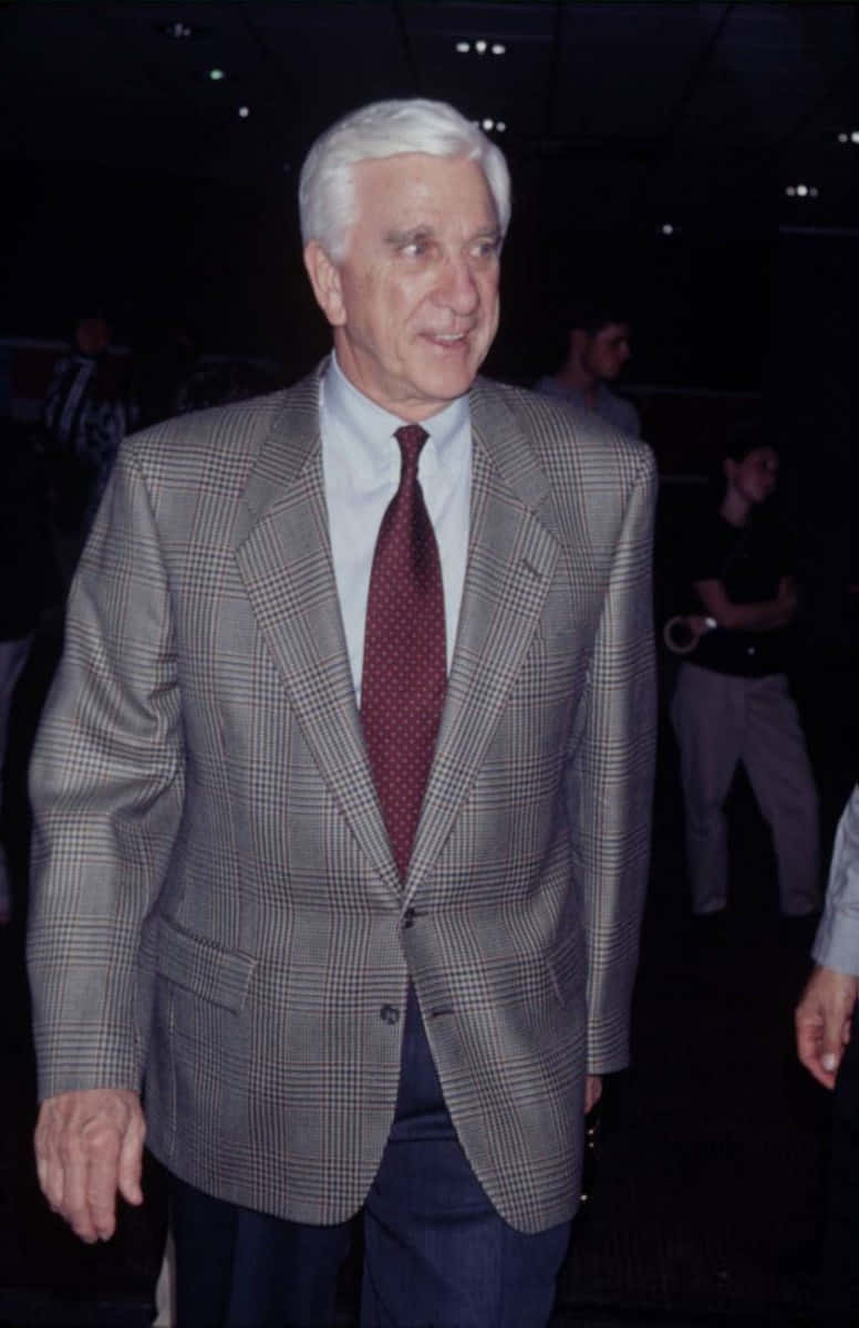 Leslie Nielsen, gray plaid suit, red polka dot tie, SD Phone Wallpaper