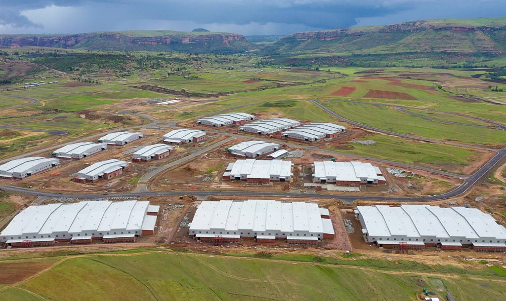 Lesotho, white-roofed industrial buildings, vast green valley, SD Desktop Wallpaper