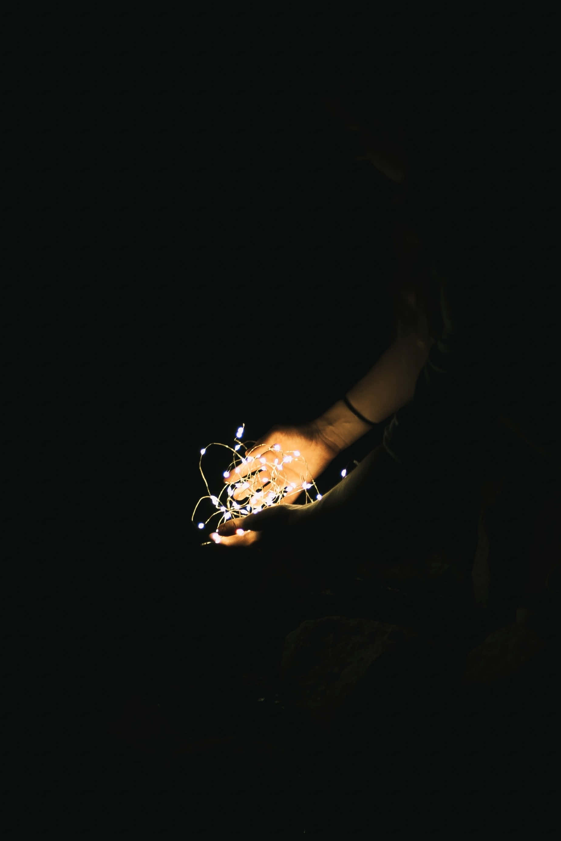 Let Go, glowing fairy lights, pitch-black background, 2K Phone Wallpaper