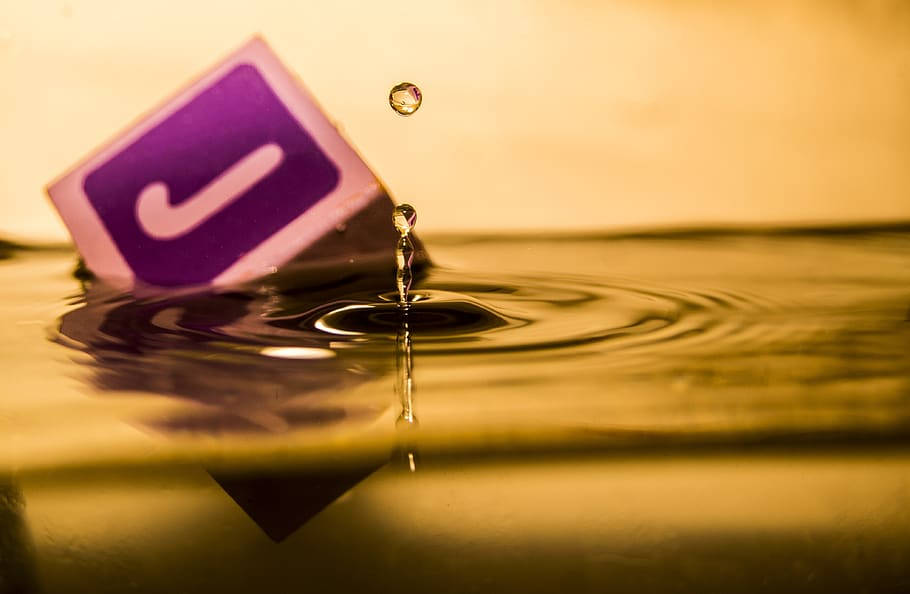 purple cube, white 'J' logo, golden water, SD Desktop Wallpaper