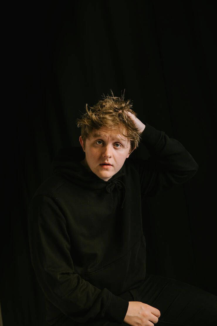 Lewis Capaldi, black hoodie, black backdrop, SD Phone Wallpaper