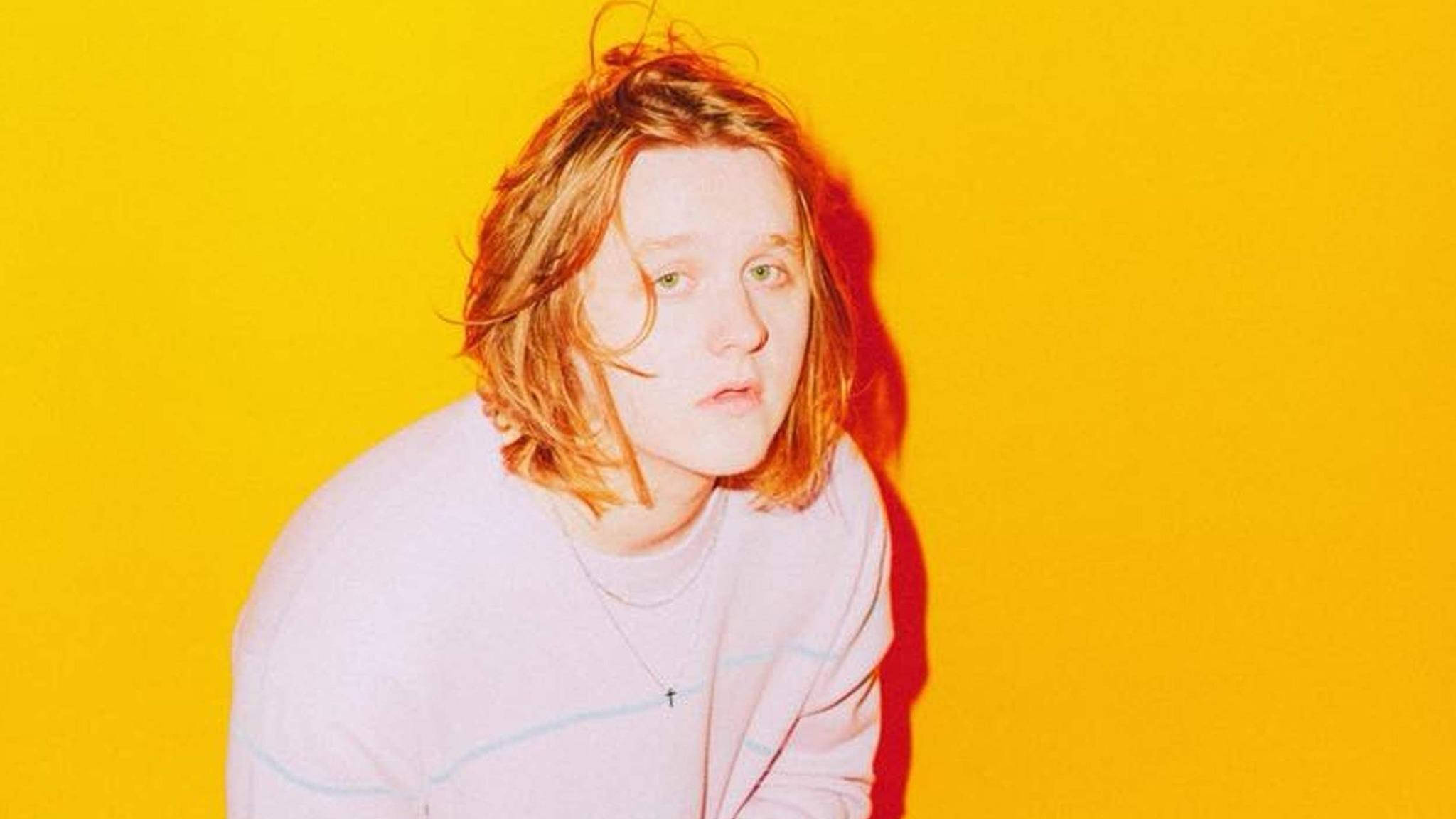 Lewis Capaldi, tousled hair, vibrant yellow background, Full HD Desktop Wallpaper