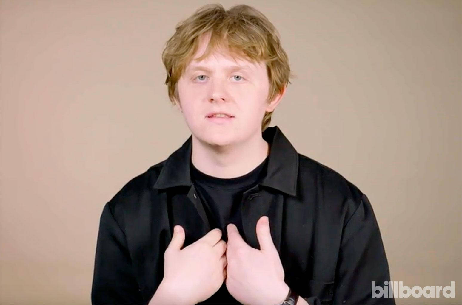 Lewis Capaldi, black shirt, beige background, HD Desktop Wallpaper