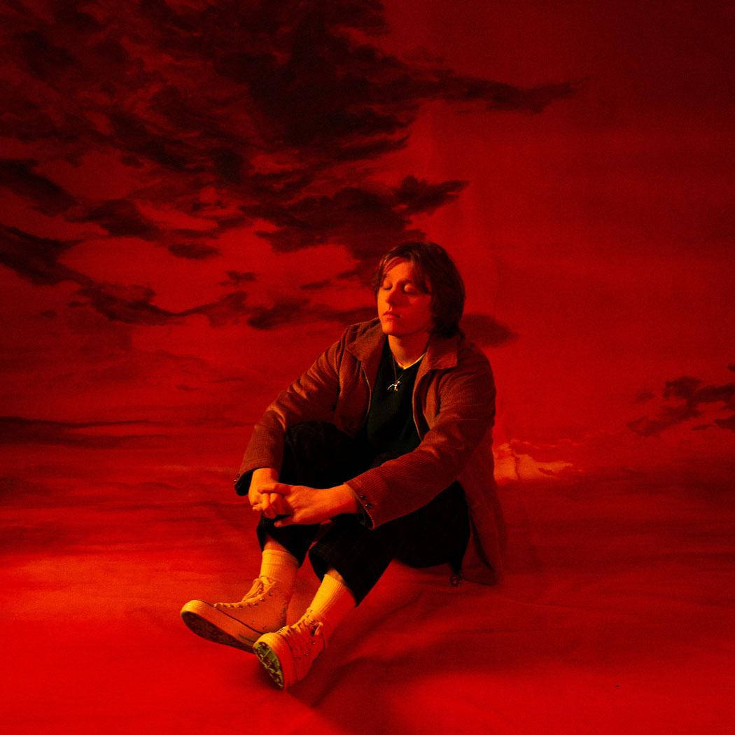 Lewis Capaldi, red-hued ground, dramatic red sky, SD Desktop Wallpaper