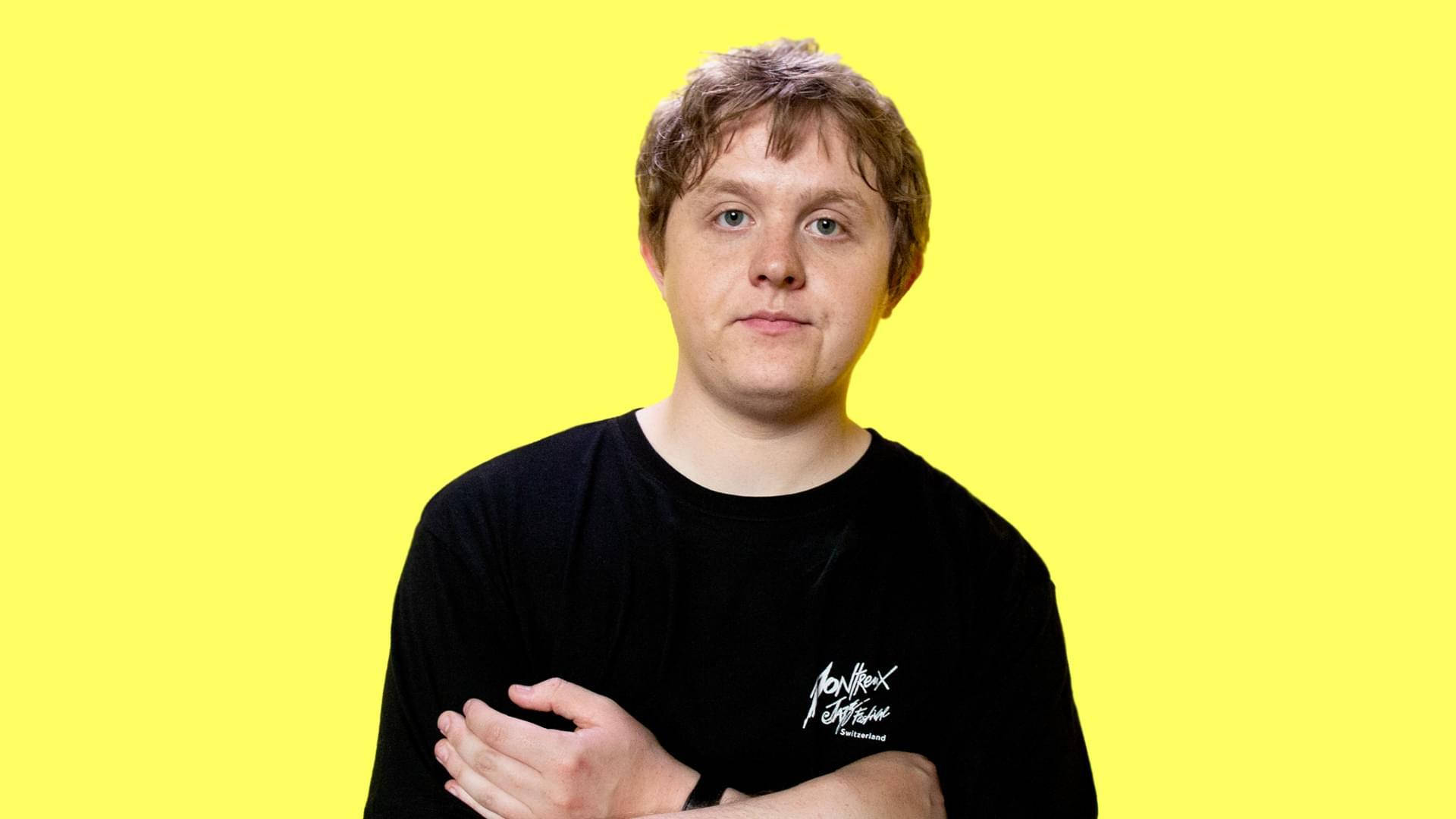 Lewis Capaldi, yellow background, black t-shirt, Full HD Desktop Wallpaper