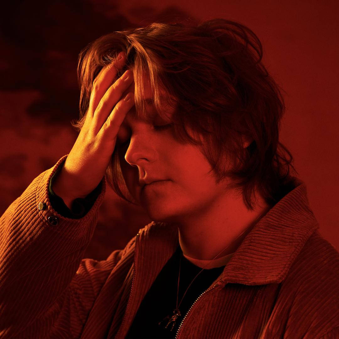Lewis Capaldi, tousled hair, warm red lighting, SD Desktop Wallpaper