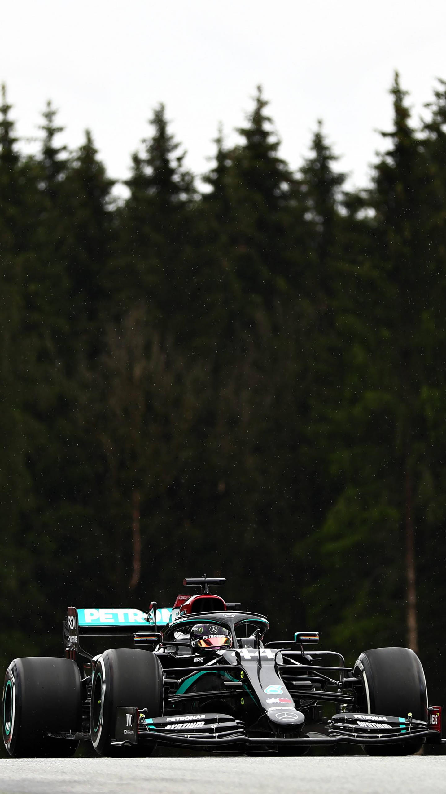 Lewis Hamilton, black and teal Formula 1 car, wet track, 2K Phone Wallpaper