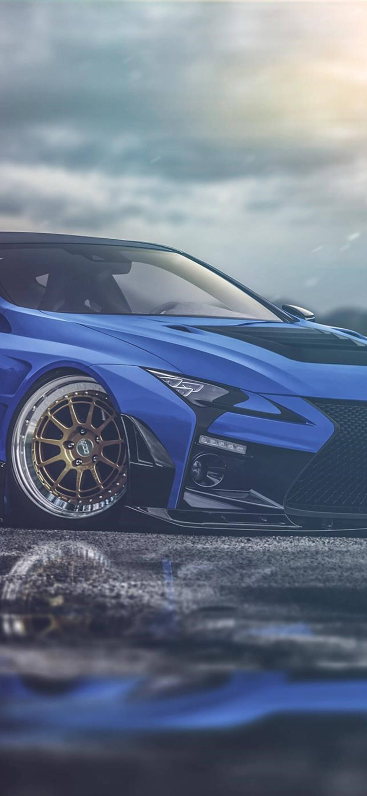 Blue Lexus, gold rims, wet pavement, 2K Phone Wallpaper