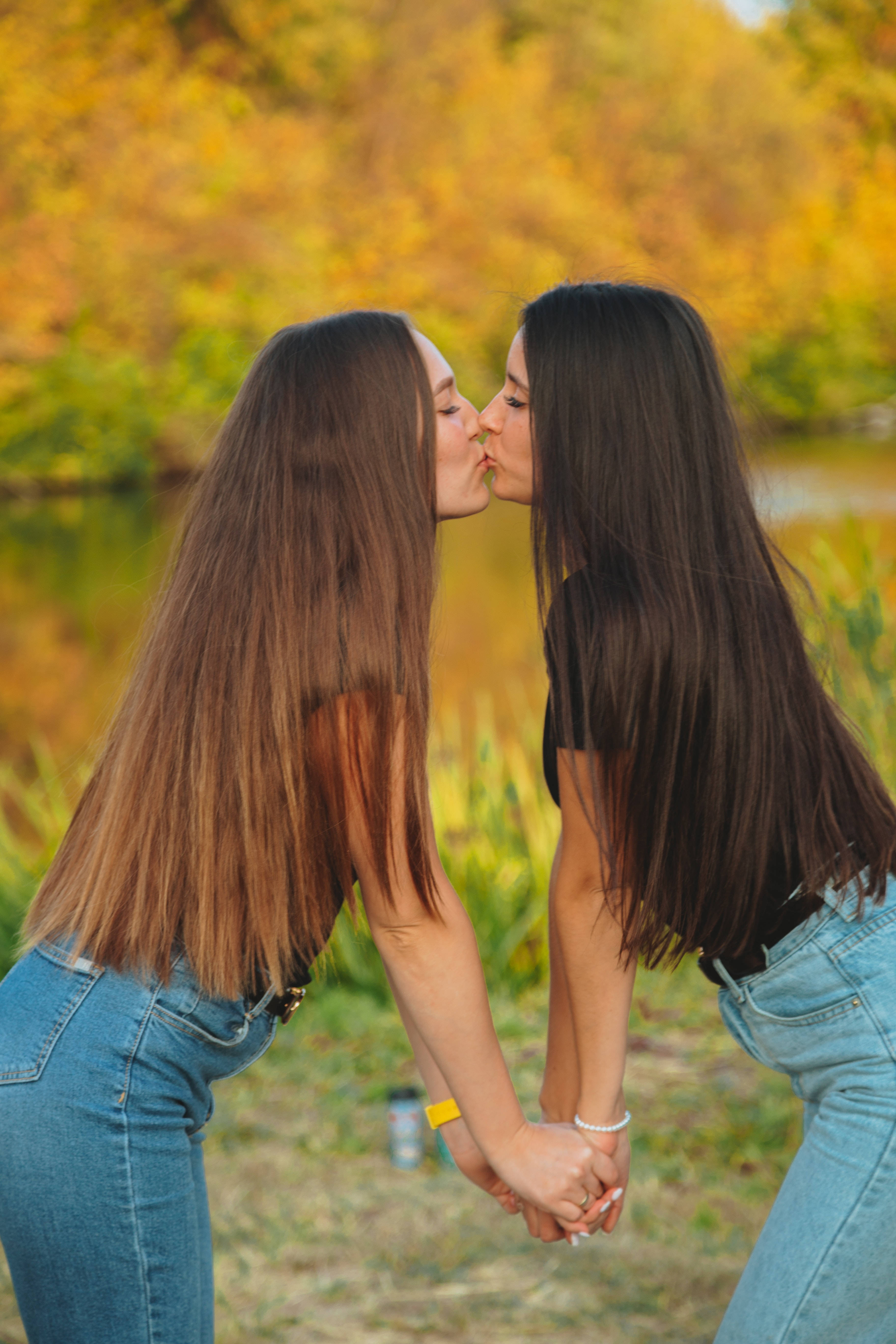 Model Girls Kissing, pond, golden autumn foliage, 5K Phone Wallpaper