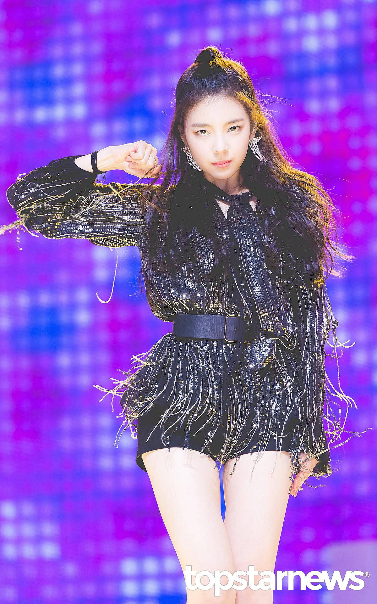 Lia, sparkling black fringe outfit, vibrant purple and blue pixelated stage backdrop, Full HD Phone Wallpaper
