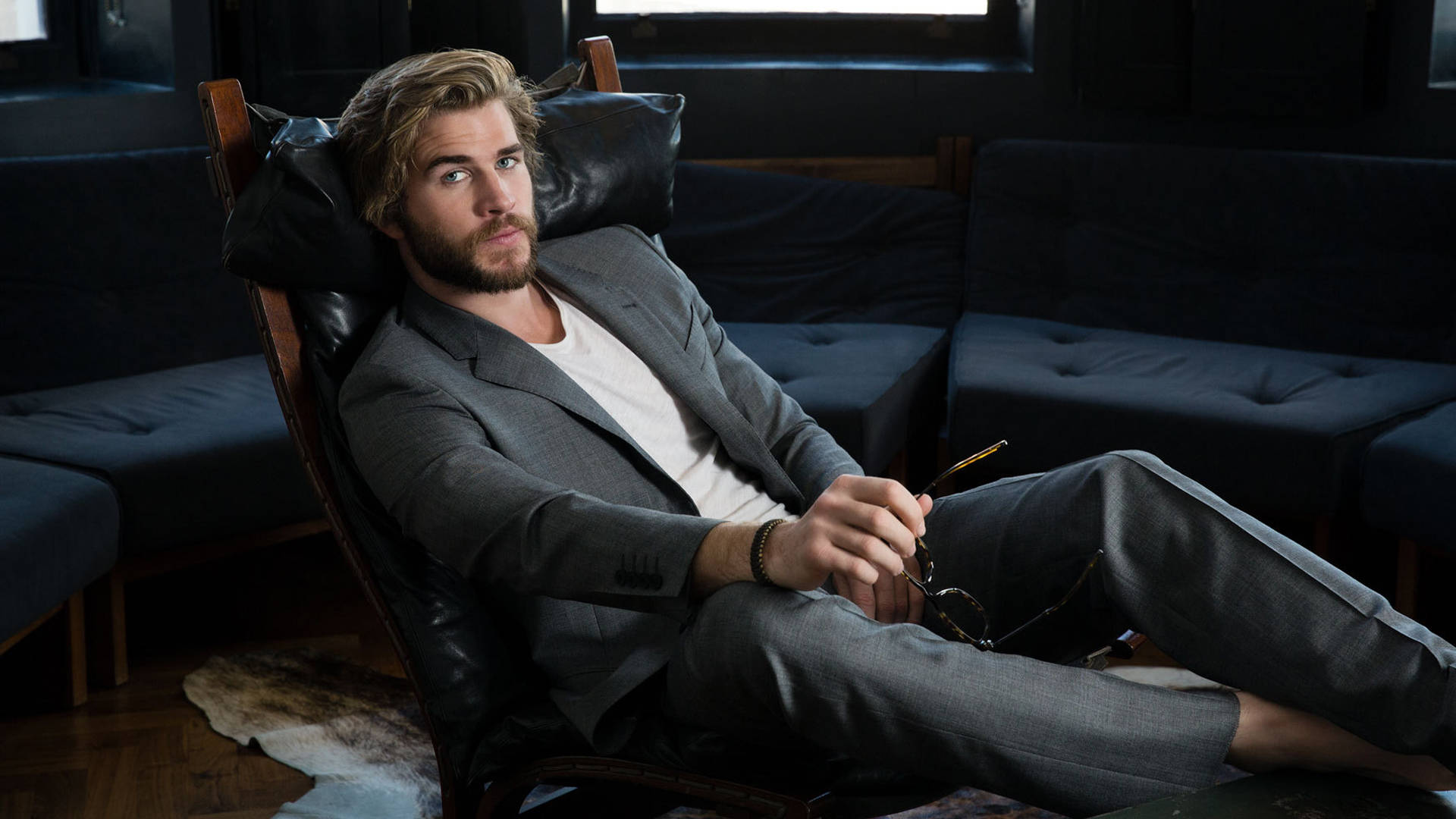 Liam Hemsworth, black couch, leather chair, Full HD Desktop Wallpaper