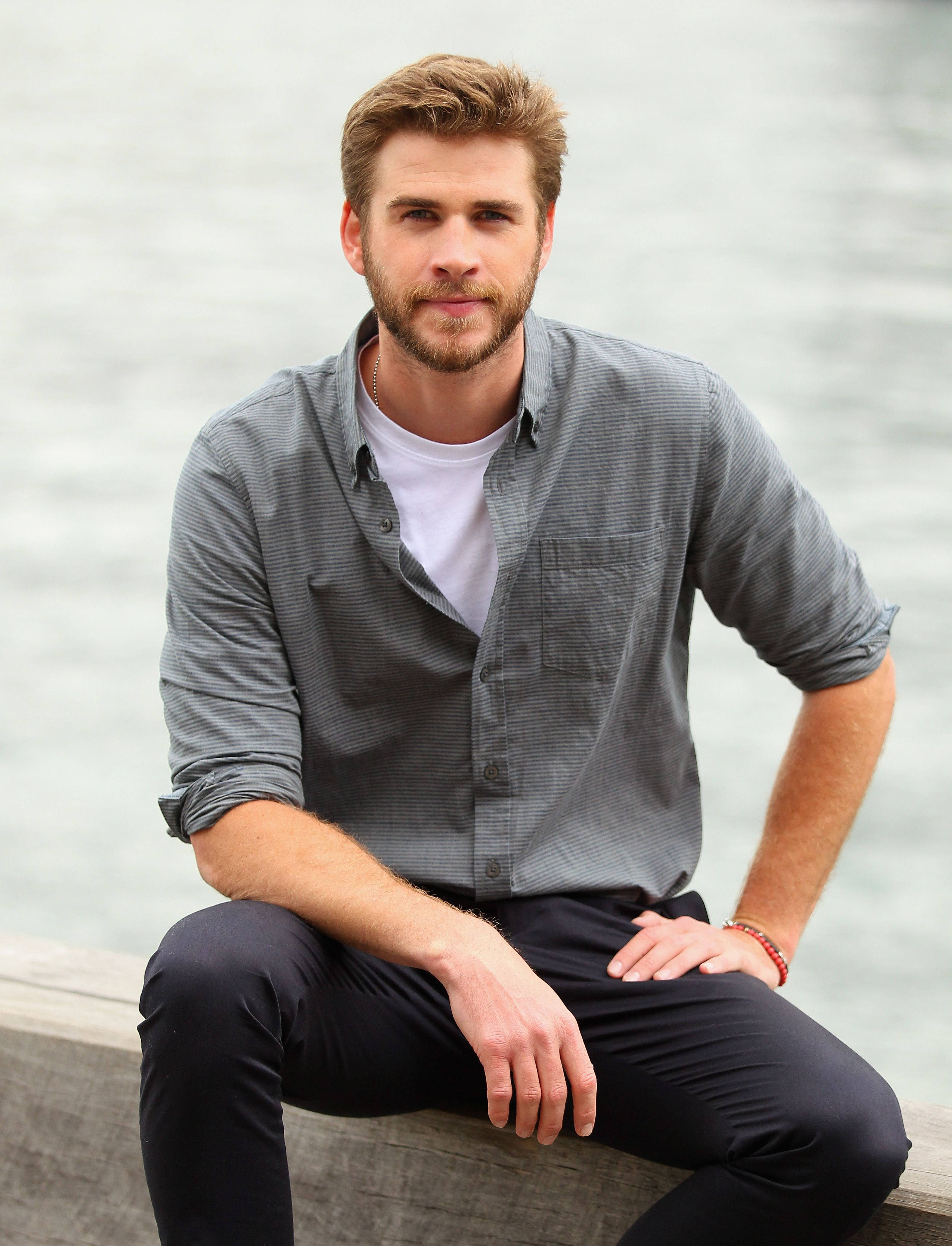 Liam Hemsworth, gray background, concrete ledge, 4K Phone Wallpaper