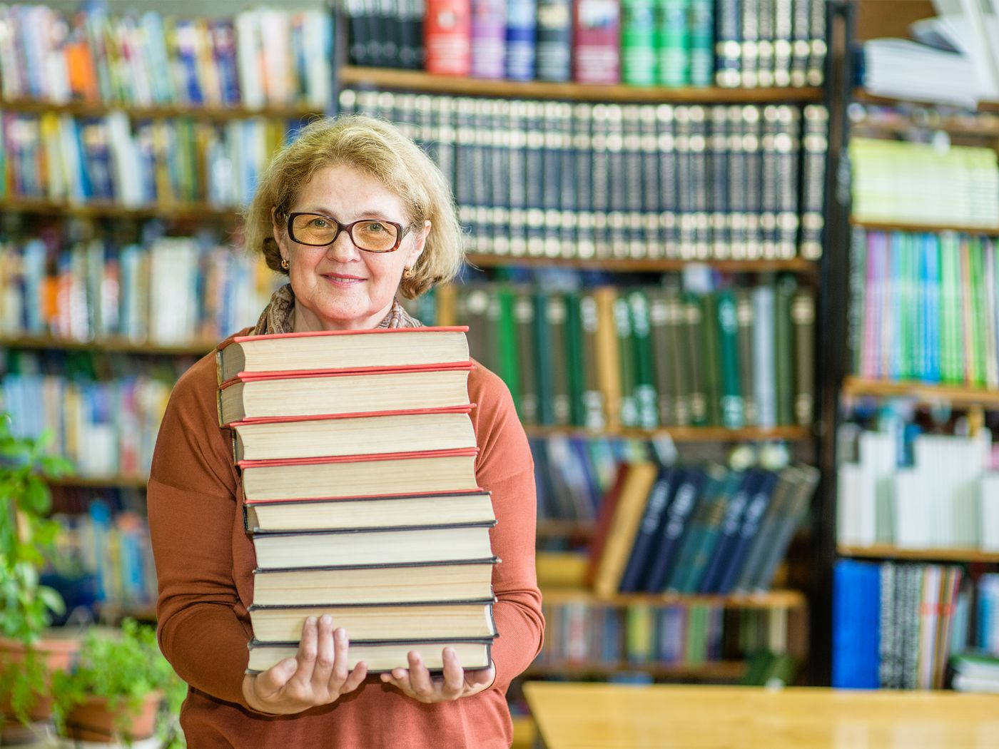 elderly librarian, glasses, tall stack of books, HD Desktop Wallpaper