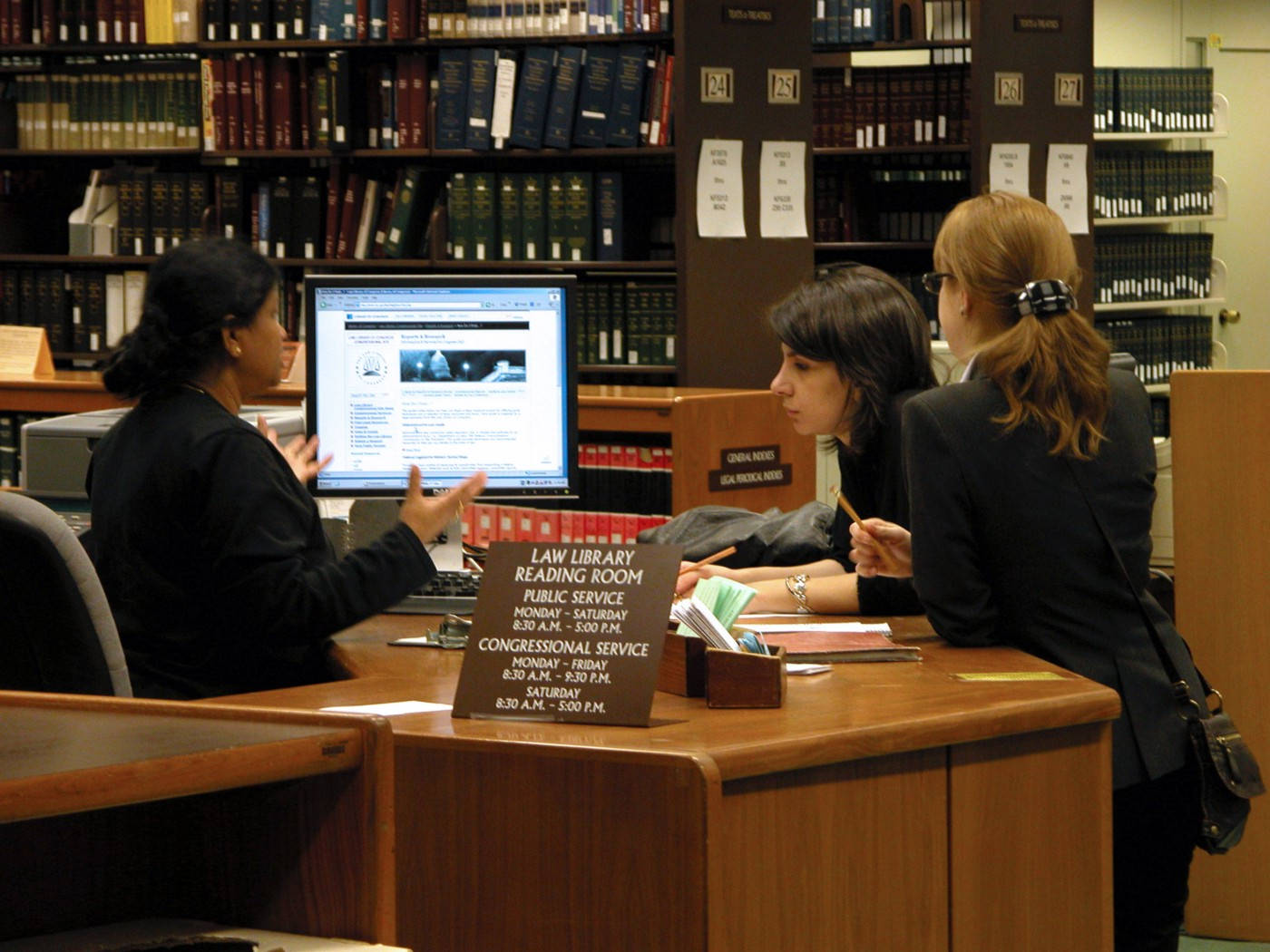 law library reading room, towering bookshelves, three women, HD Desktop Wallpaper