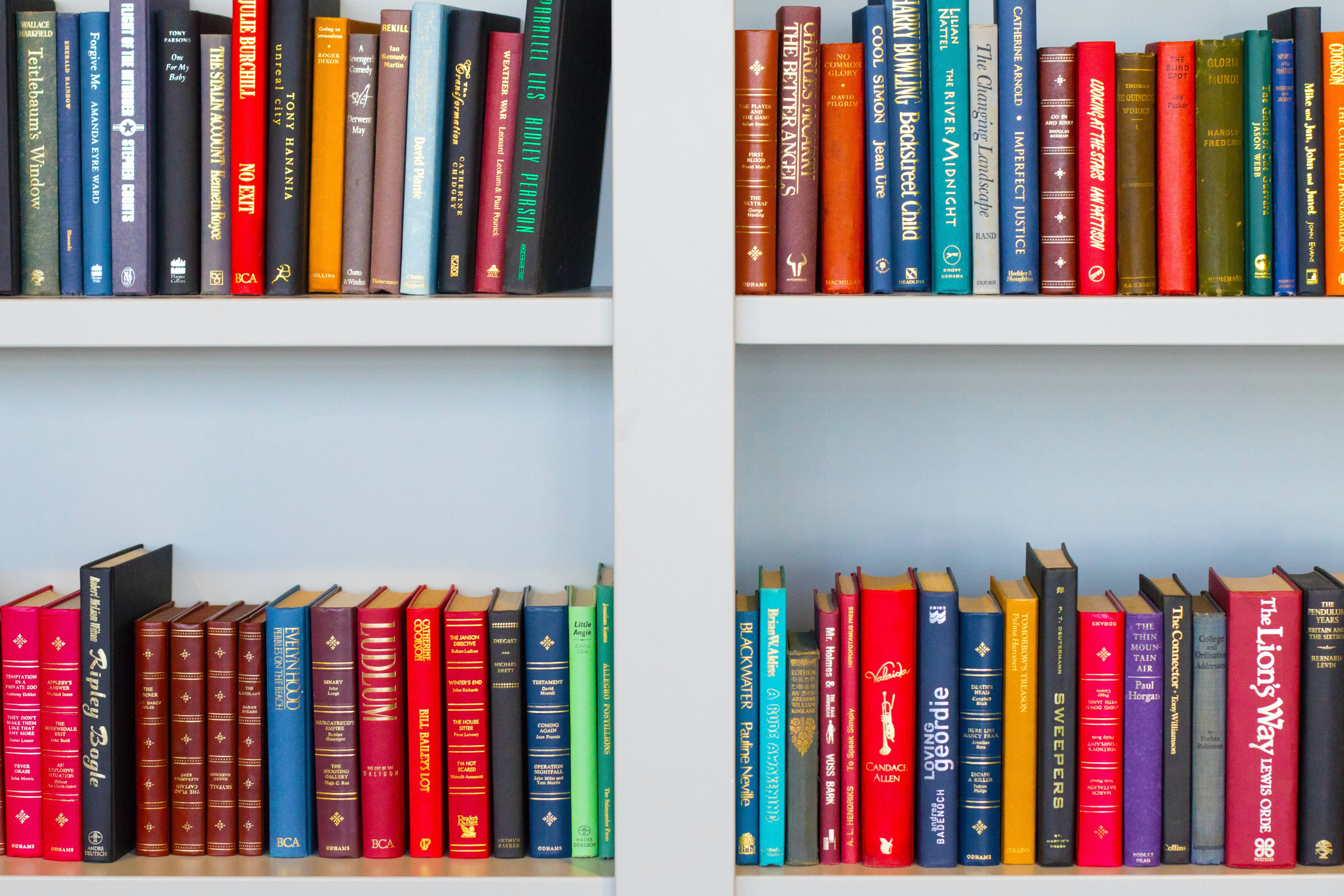 colorful books, white shelves, soft blue wall, 5K Desktop Wallpaper