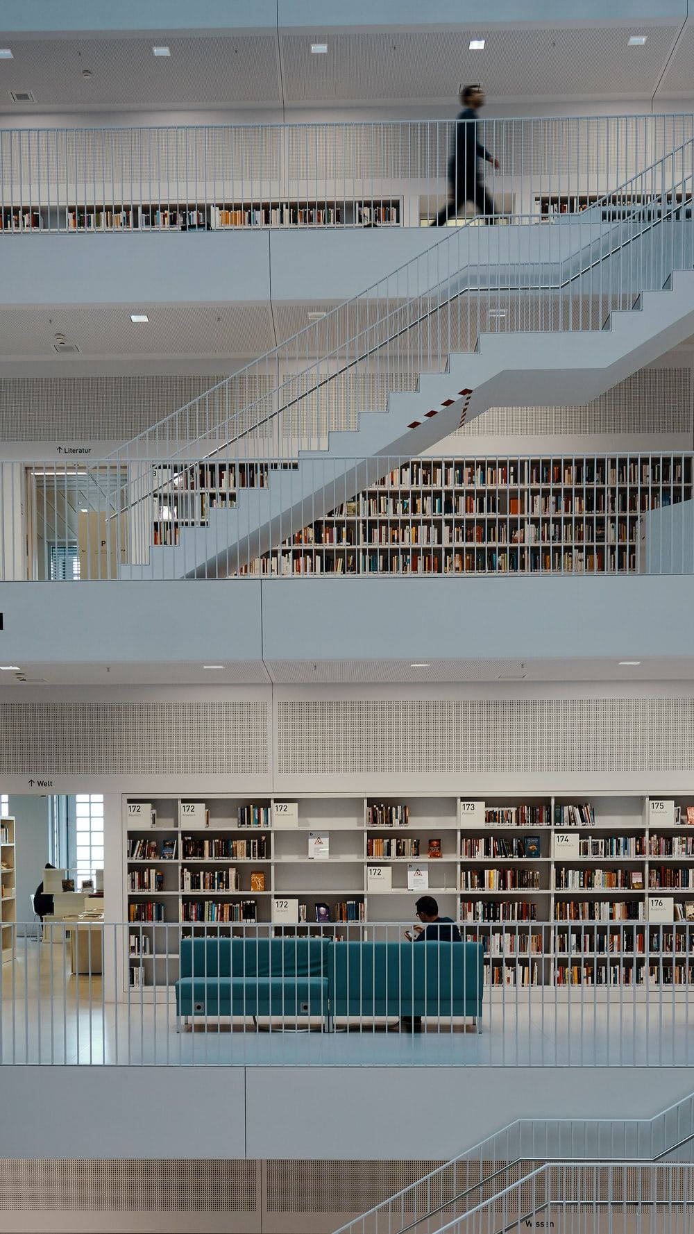 modern library, white staircases, bookshelves filled with books, HD Phone Wallpaper