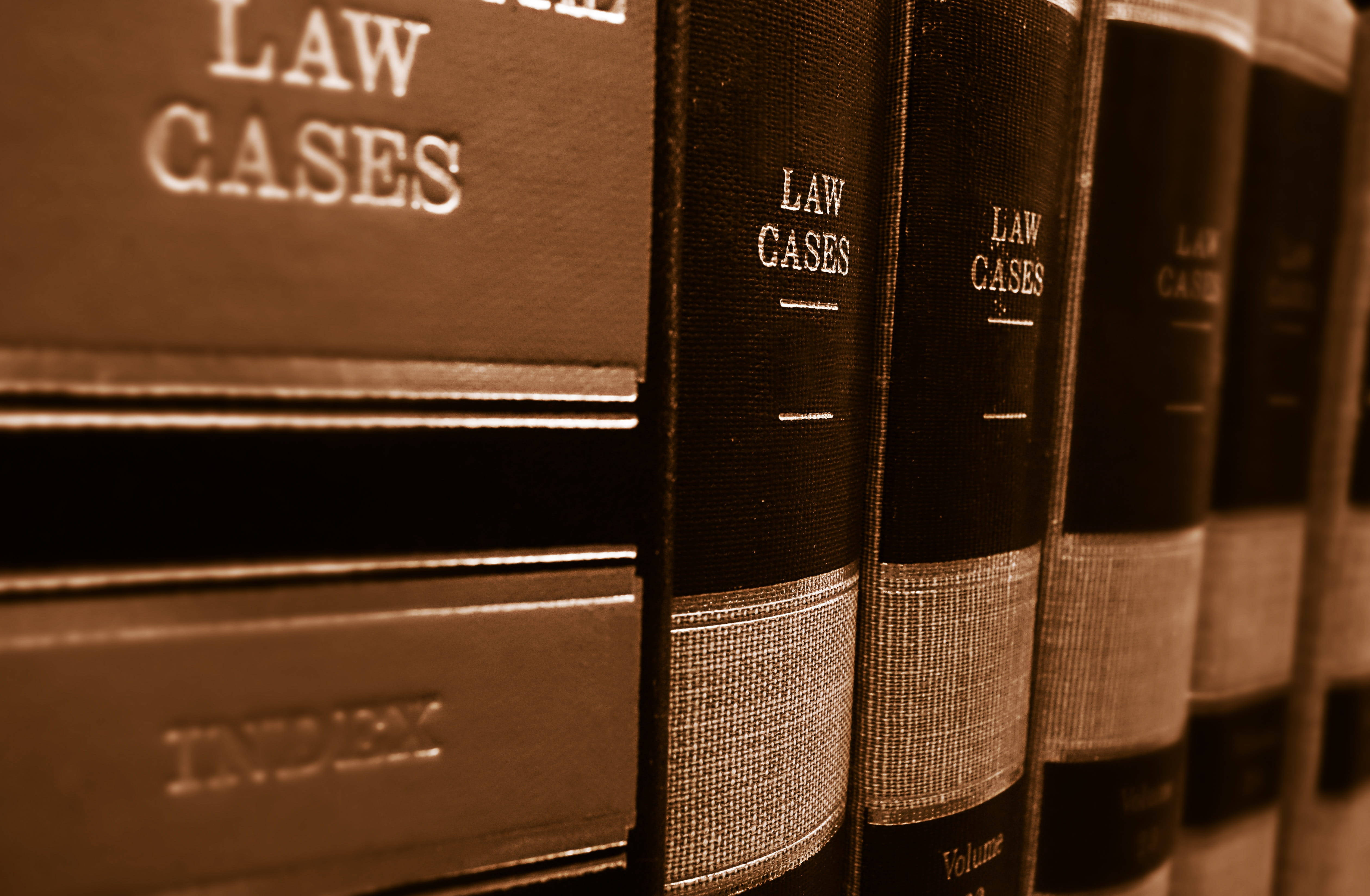 Law Cases Reference Books, vintage law case books, sepia-toned library shelf, 4K Desktop Wallpaper