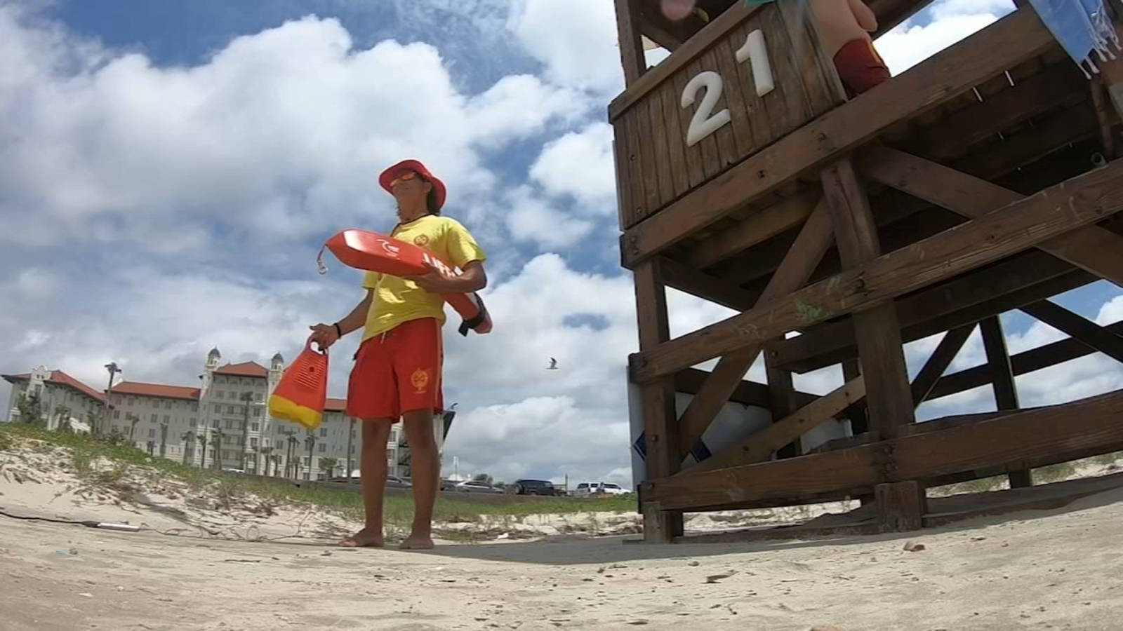 Lifeguard, bright yellow and red gear, sandy beach, HD Desktop Wallpaper