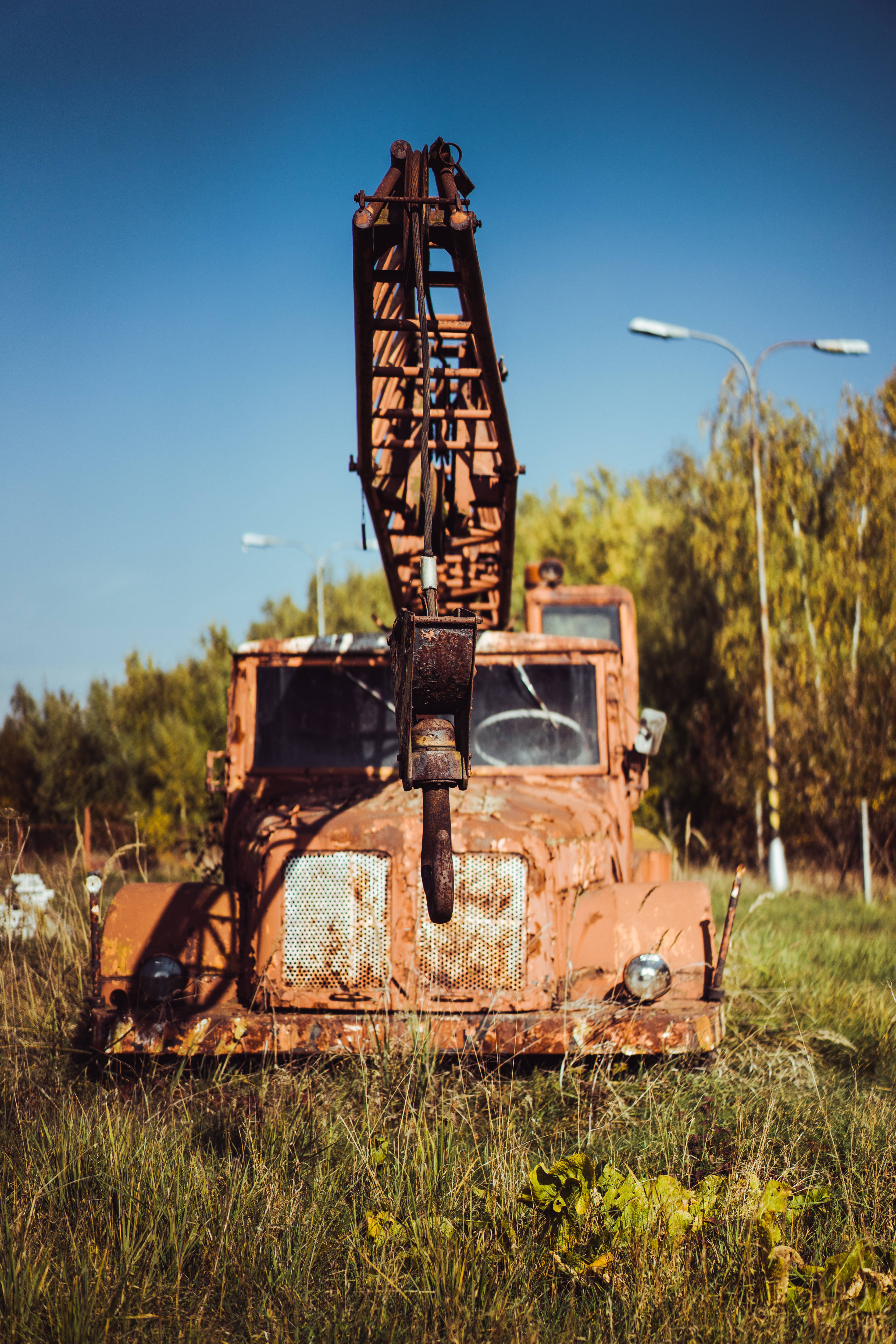 rusty old cool truck crane, rusted orange crane truck, tall grass, 4K Phone Wallpaper