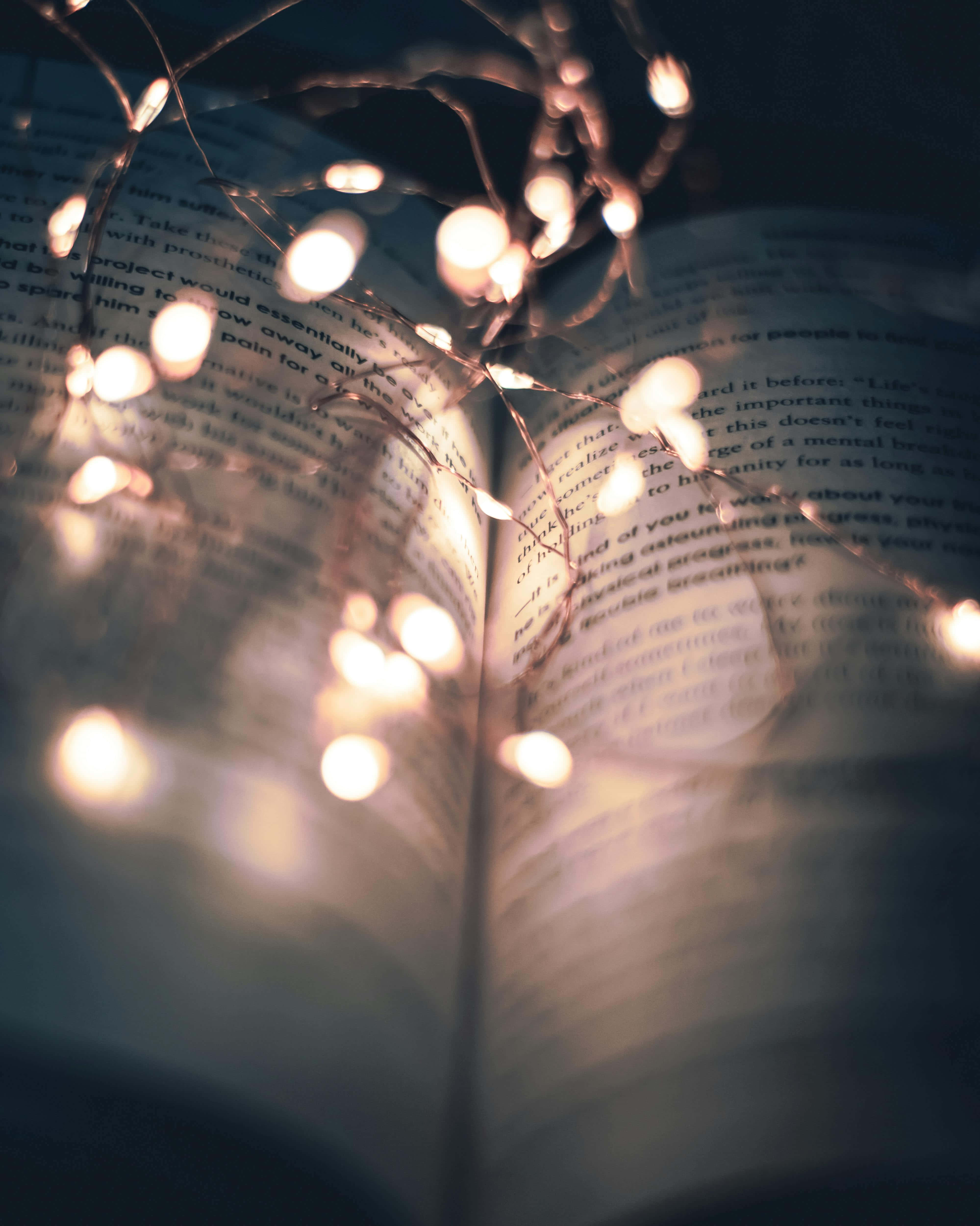 twinkling lights, open book, cozy nighttime setting, 4K Phone Wallpaper
