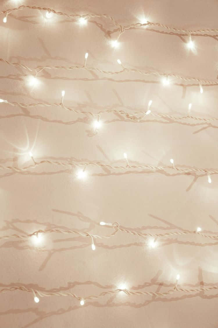 warm twinkle lights, pale pink wall, glowing string lights, SD Phone Wallpaper