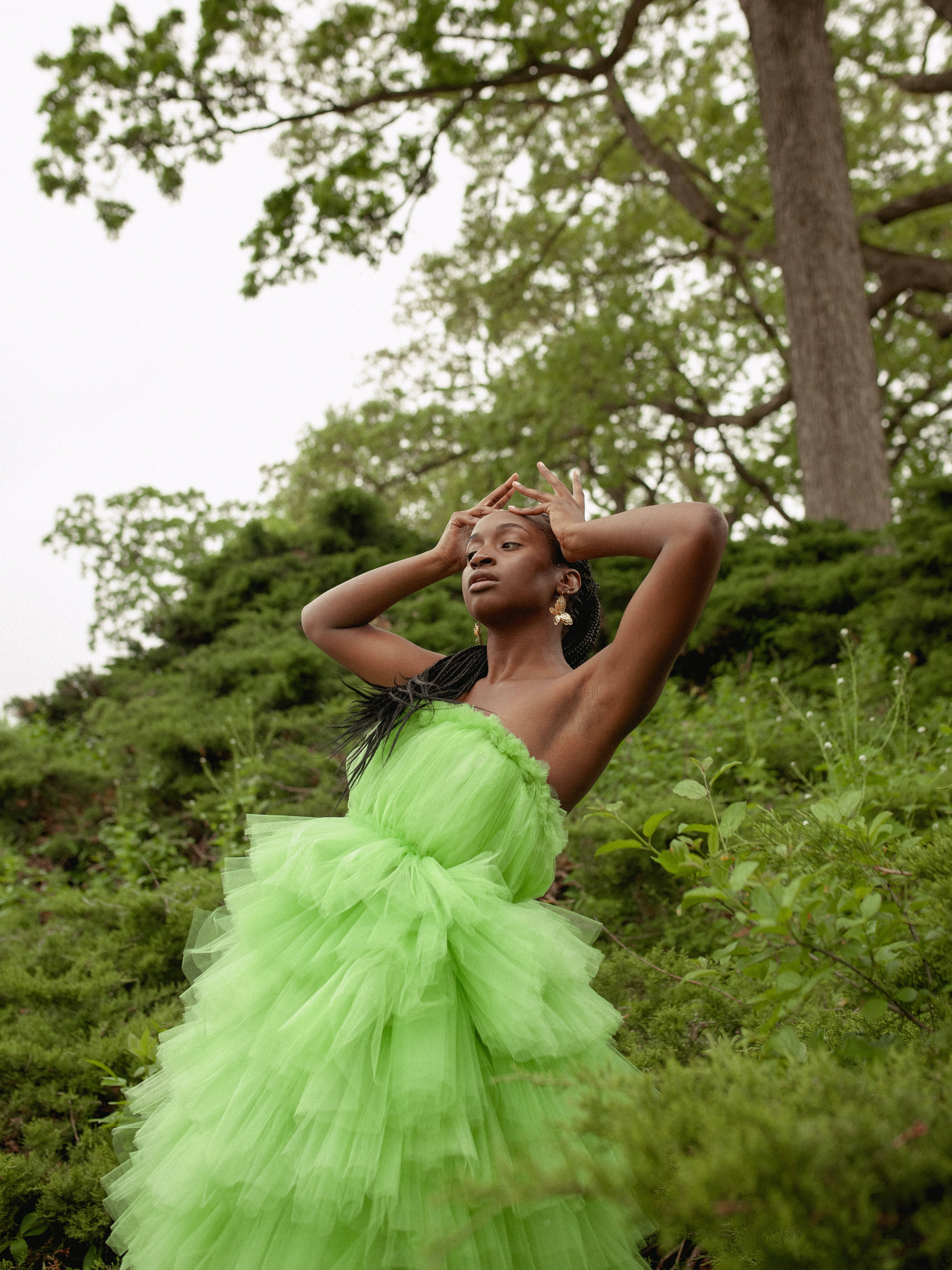 vibrant lime green tulle gown, lush green foliage, overcast sky, 4K Phone Wallpaper