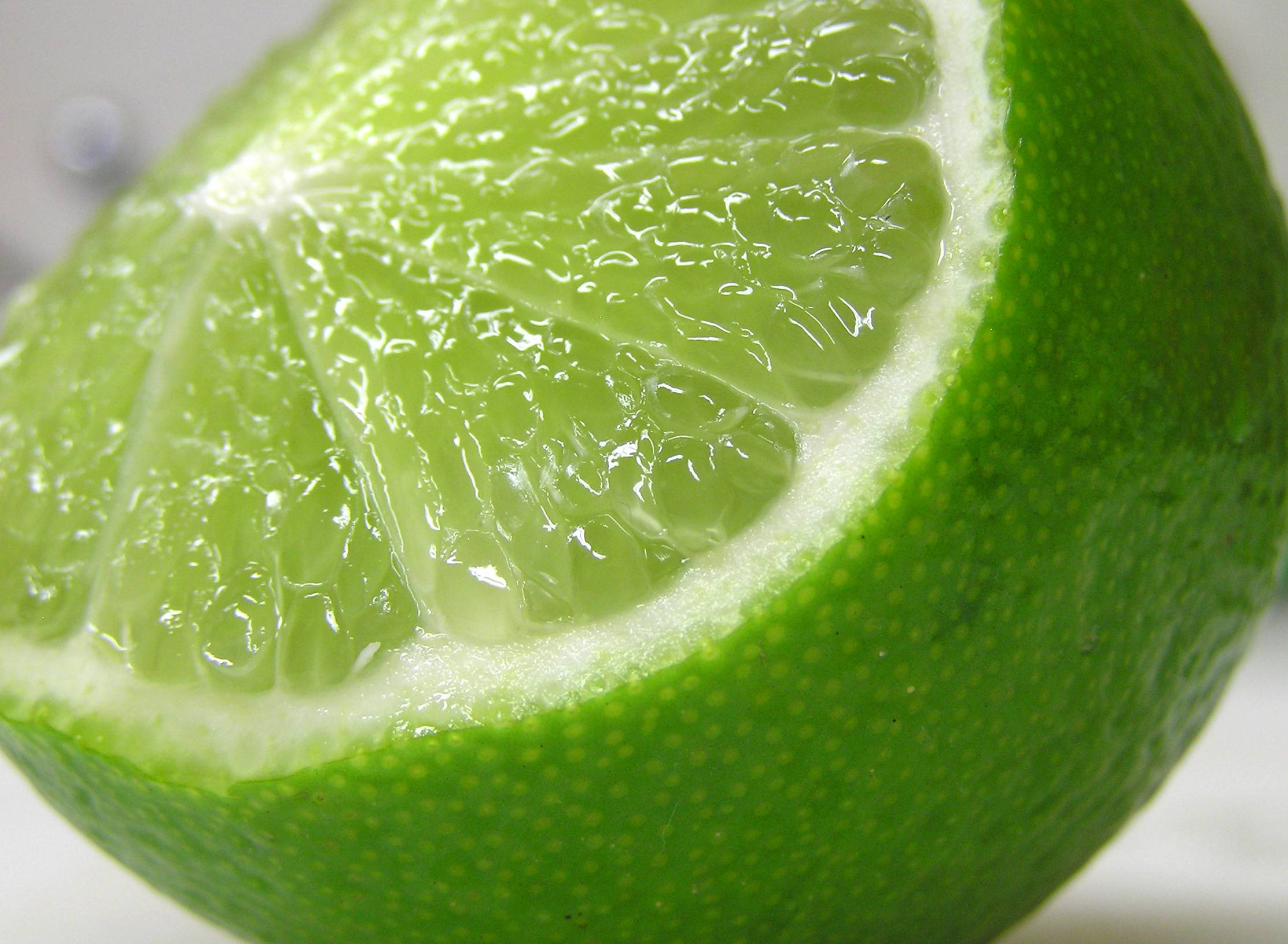 freshly cut lime, juicy translucent segments, textured green rind, Full HD Desktop Wallpaper
