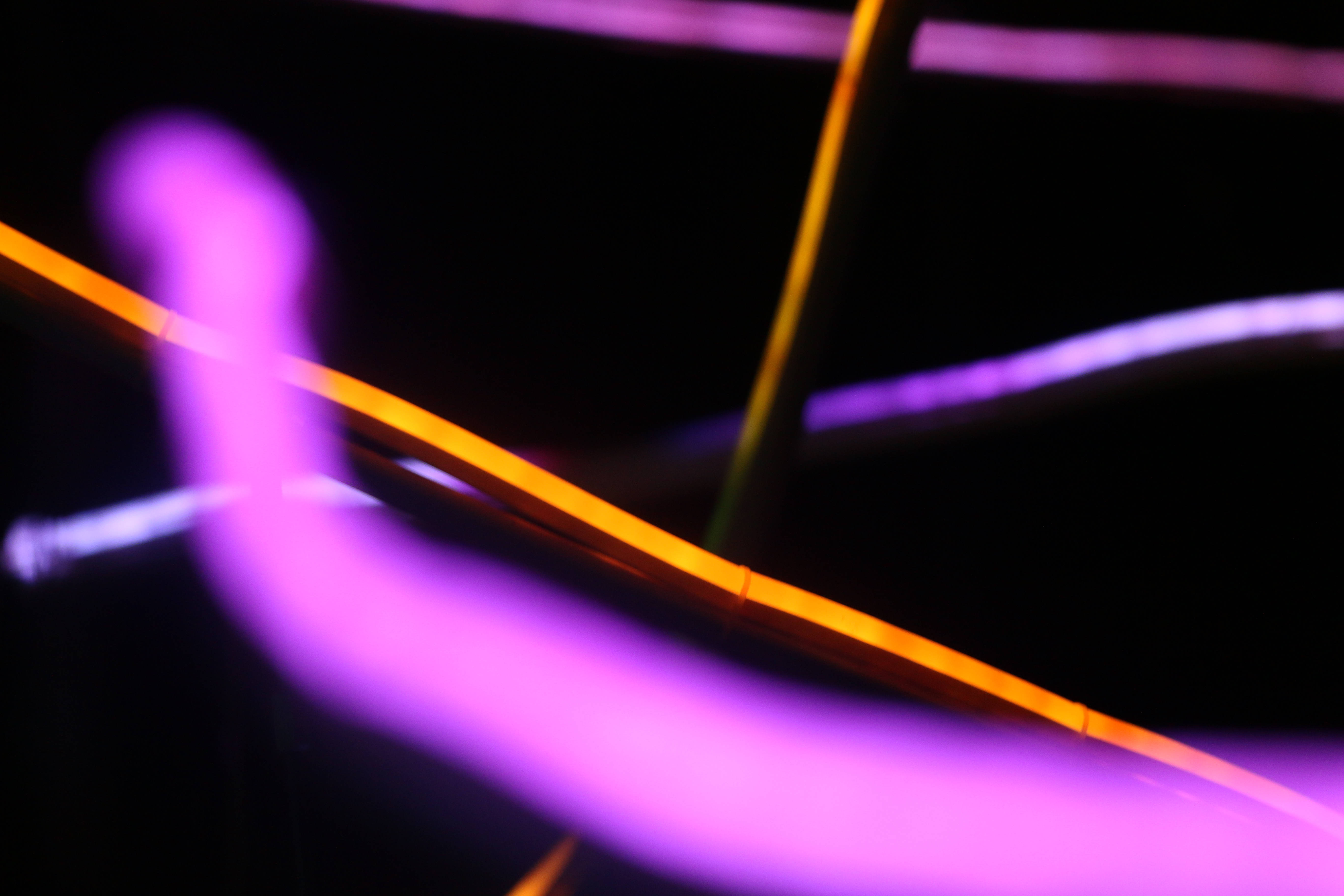 light purple, orange rays of light, deep black background, 5K Desktop Wallpaper