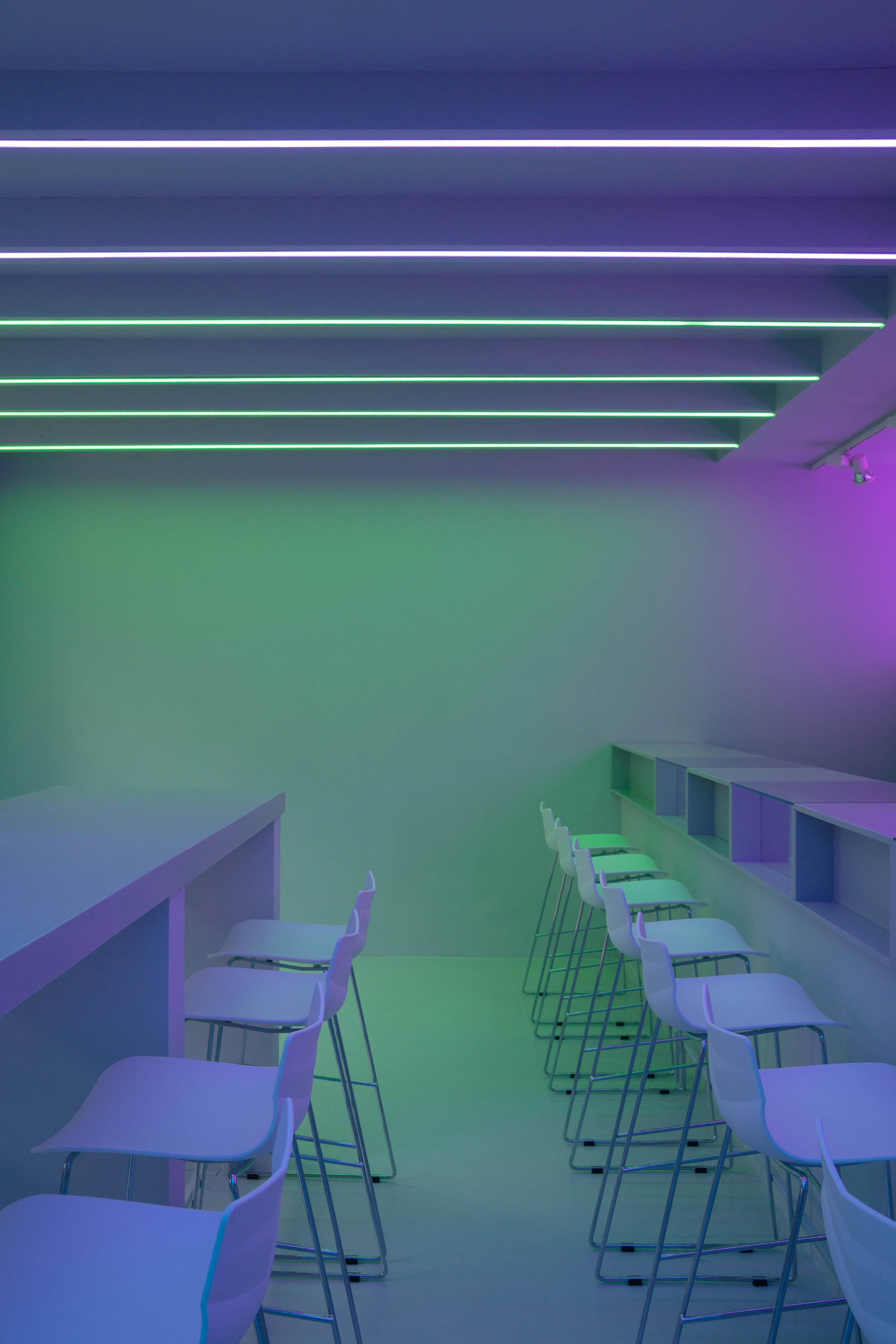 neon purple, green minimalist wall, white bar stools, 4K Phone Wallpaper