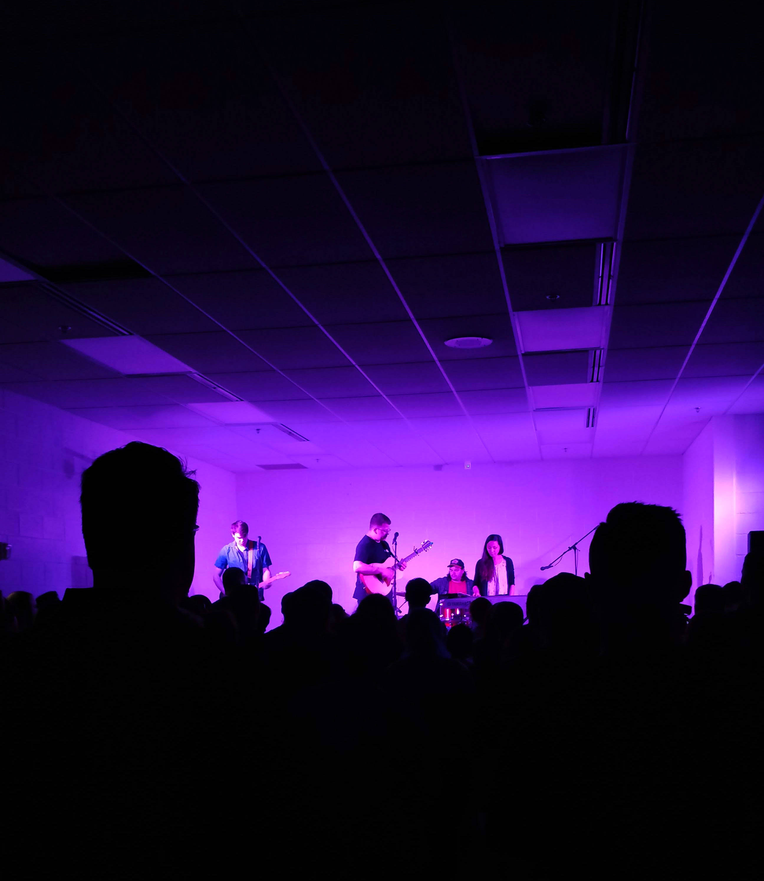 acoustic concert, light purple lighting, vibrant purple stage lights, 2K Phone Wallpaper