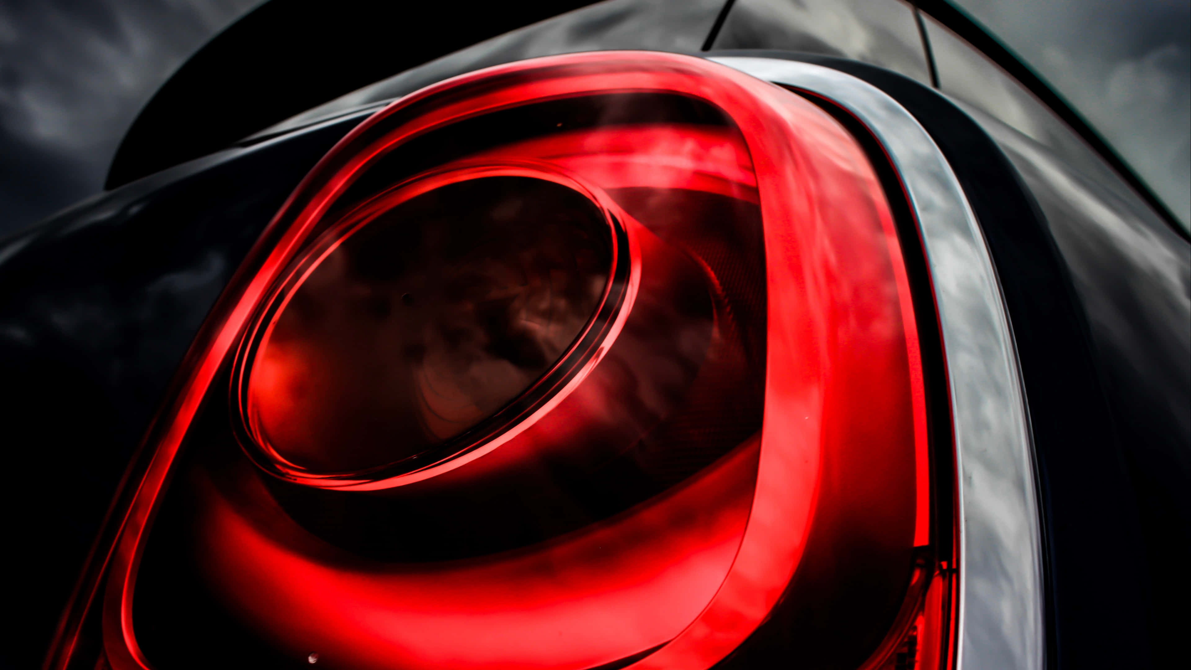 Light Red Aesthetic, glowing red car taillight, sleek curves, 4K Desktop Wallpaper