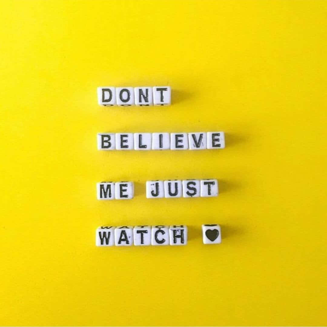 DONT BELIEVE ME JUST WATCH, bright yellow background, white letter tiles, SD Desktop Wallpaper