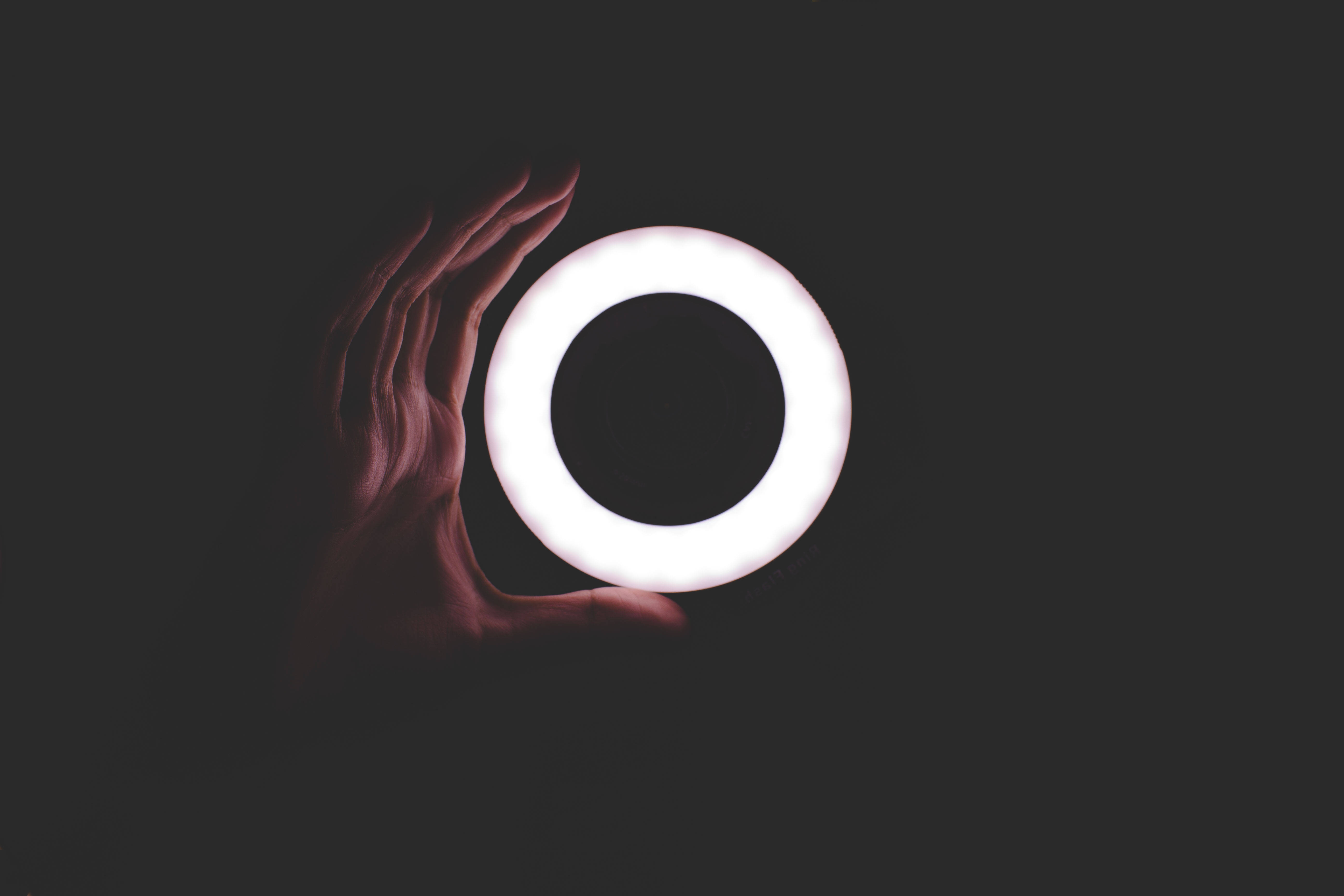 minimalist small ring led light, glowing white ring, dark background, 5K Desktop Wallpaper